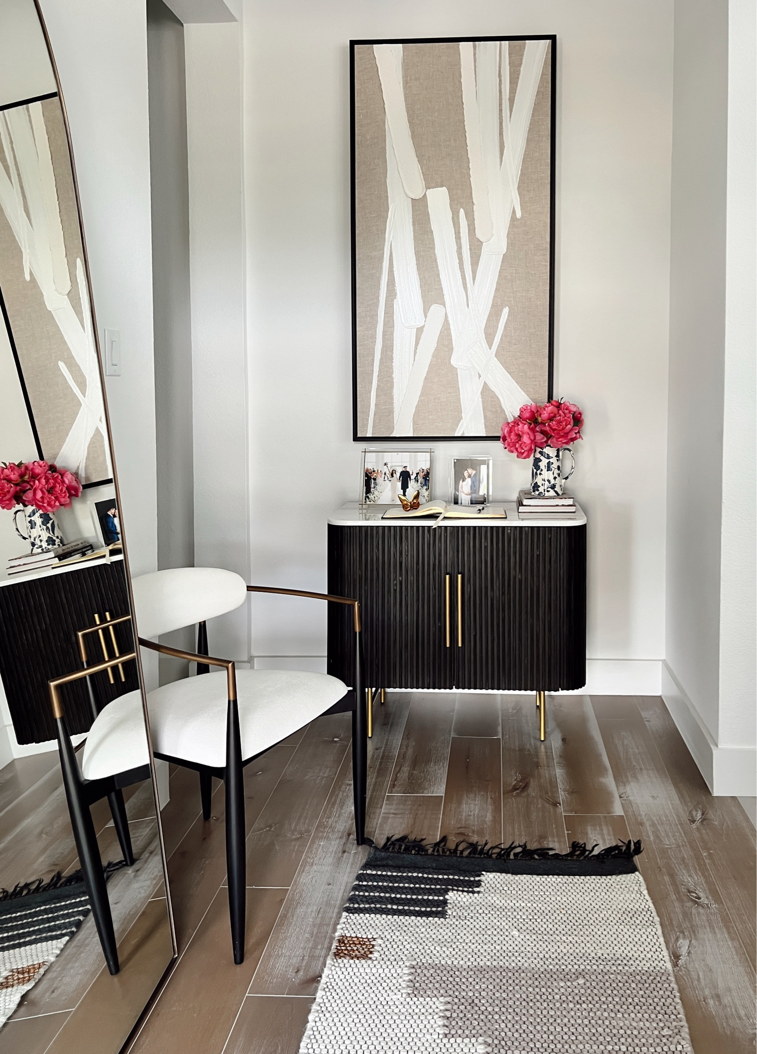 Entryway chest for storage in our home. We love this wool runner rug because it’s durable easy to clean and matches all of the colors in our entryway. The oversized art is one of our favorite pieces in our home and I love the texture on it. We have a guestbook for guest to sign, which we love because we’ll go back through it and remember all the memories we had in this house.

#LTKHome