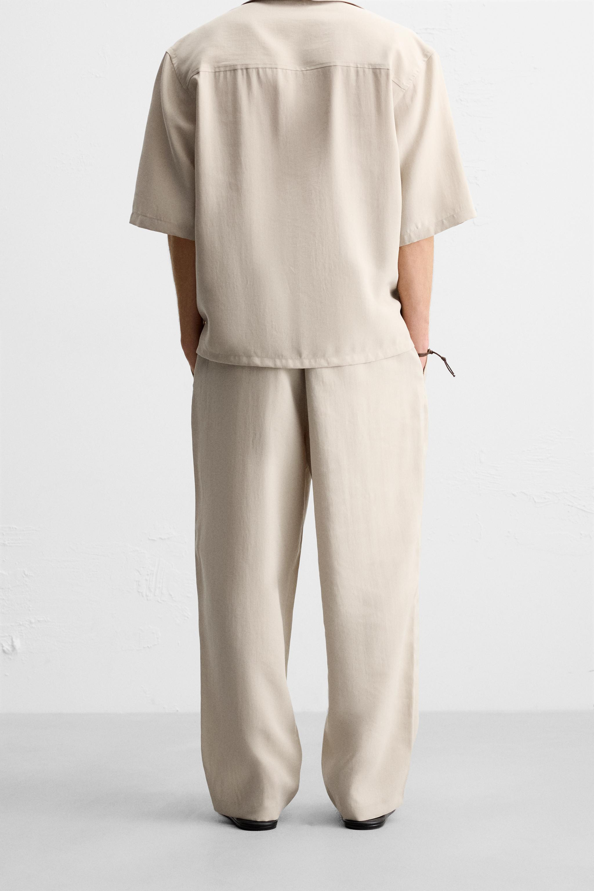 FLOWING PLEATED TROUSERS Light beige Chocolate Black | Zara UK