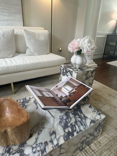 Neutral coffee table styling in my living room 💕 
Natural decor 
marble plinth table
Acrylic book easel 
Floral
Peonies 


#LTKhome #LTKsalealert