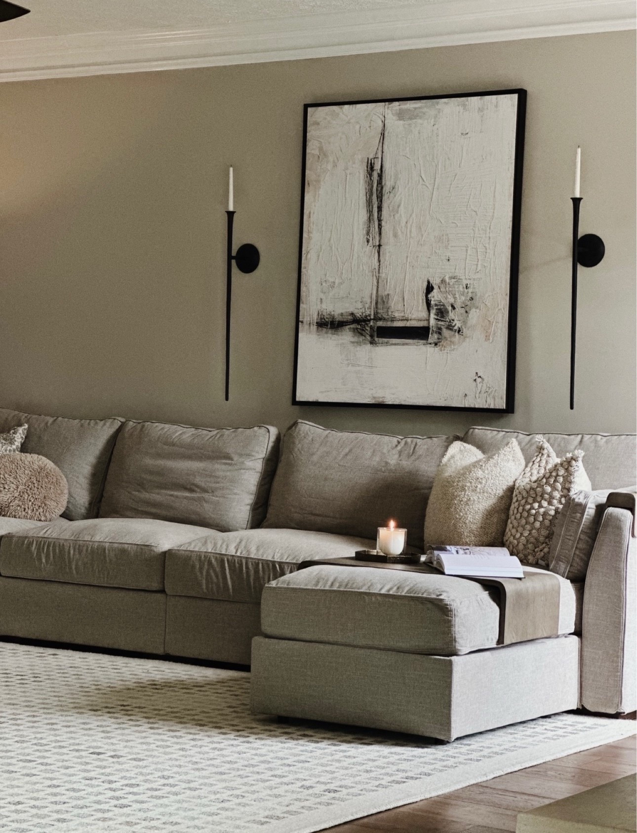 Cozy, neutral, and effortlessly stylish—creating a warm and inviting living space with modern minimalism.

neutral living room, cozy home decor, modern minimalist design, taupe sectional sofa, abstract wall art, black wall sconces, textured throw pillows, warm neutral aesthetic, contemporary home styling, elegant living space

#LTKHome #LTKSpringSale #LTKSaleAlert