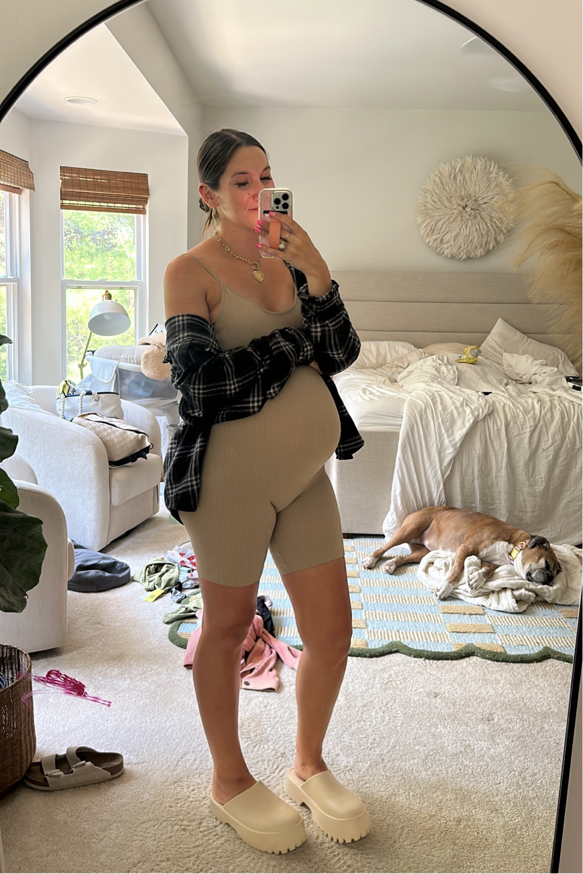 My rule when dressing the bump: something right/something loose. 

This ribbed romper is Walmart but Amazon has a ton linked here too. This is my husband’s flannel from target! Mules from target also! 