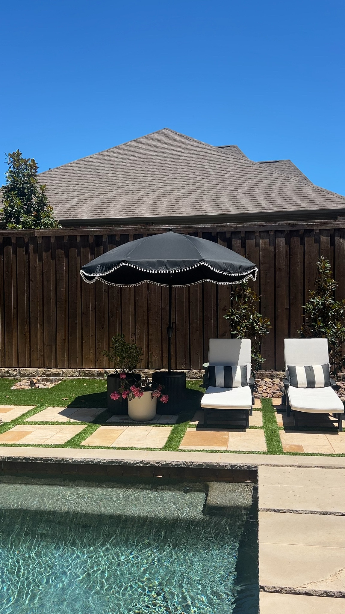 Proof that sticking to a simple black + neutral palette makes everything feel high-end. The layered pavers, clean-lined loungers, and oversized planters give this backyard such a polished vibe. Shop similar pieces here.

backyard makeover, outdoor lounge chairs, neutral patio decor, modern outdoor furniture, black patio umbrella, pool landscaping ideas, patio styling, luxury backyard look, Amazon patio


#LTKHome #LTKSeasonal