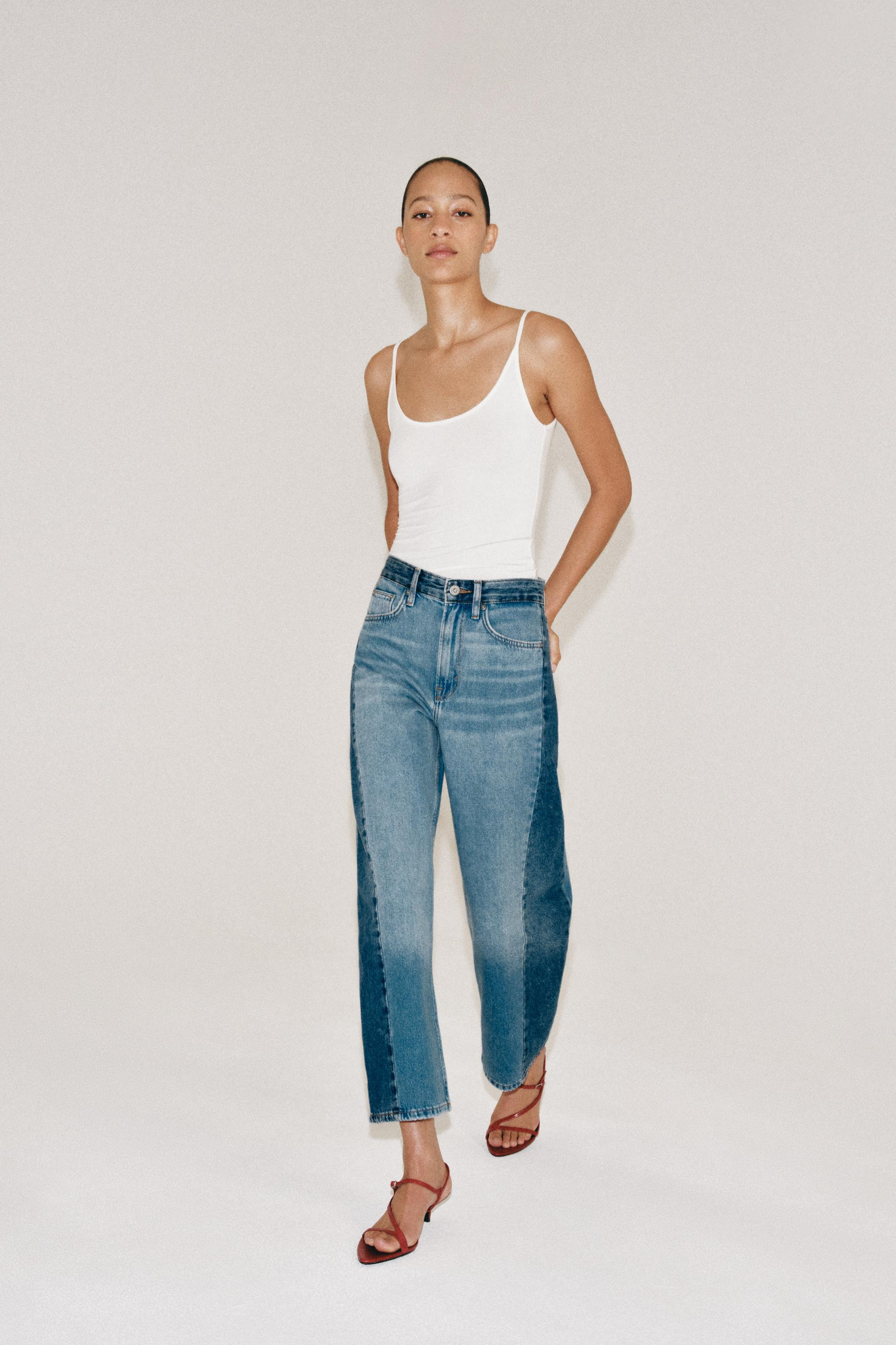 ZARA WOMAN COLLECTION Mid-rise jeans featuring belt loops and five-pocket styling. Contrasting de... | Zara US