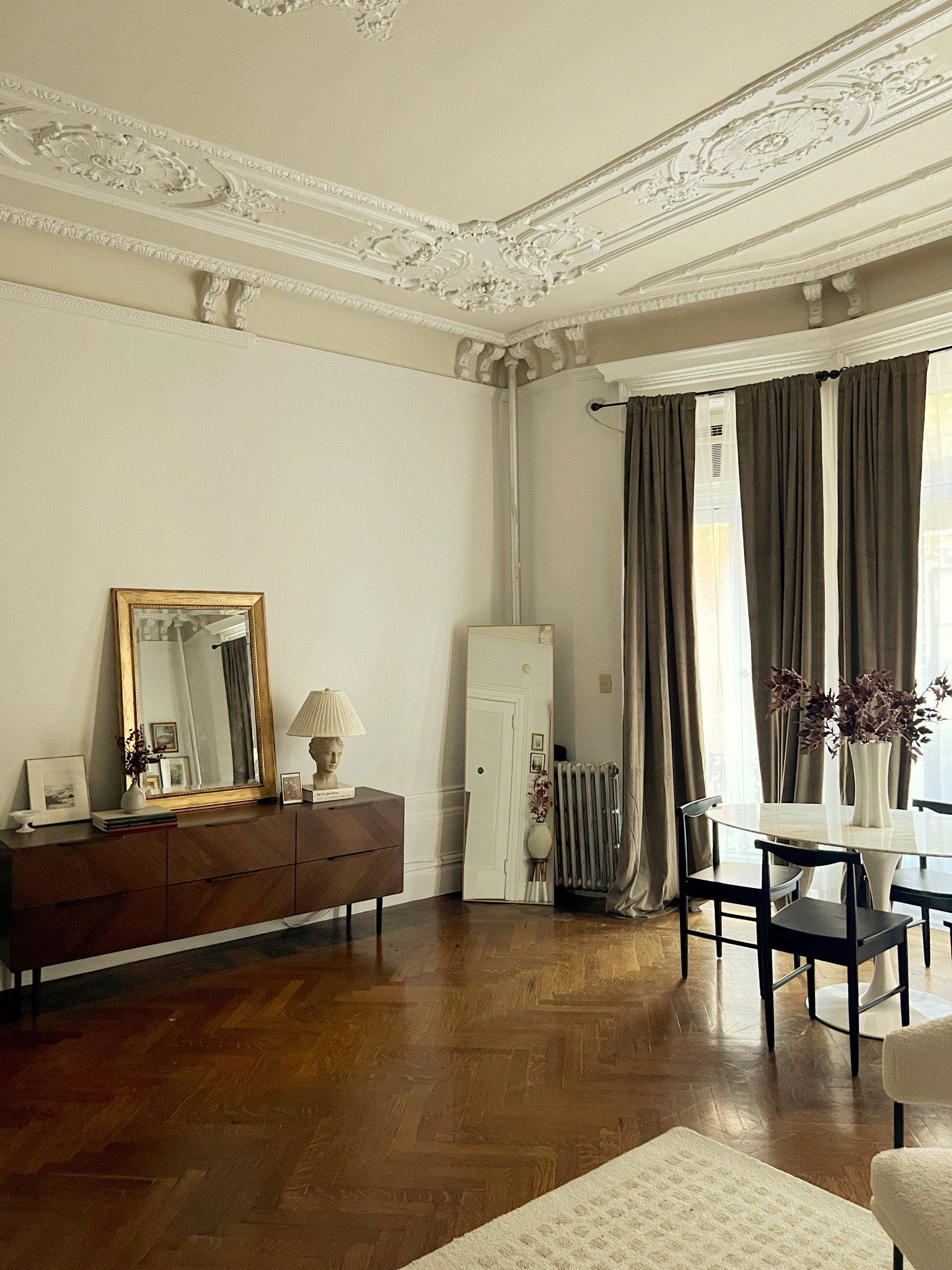 Table lamp, gold floor mirror, marble table, white vase, faux fall stems, black dining chair, neutral rug 

#LTKSeasonal #LTKstyletip #LTKhome