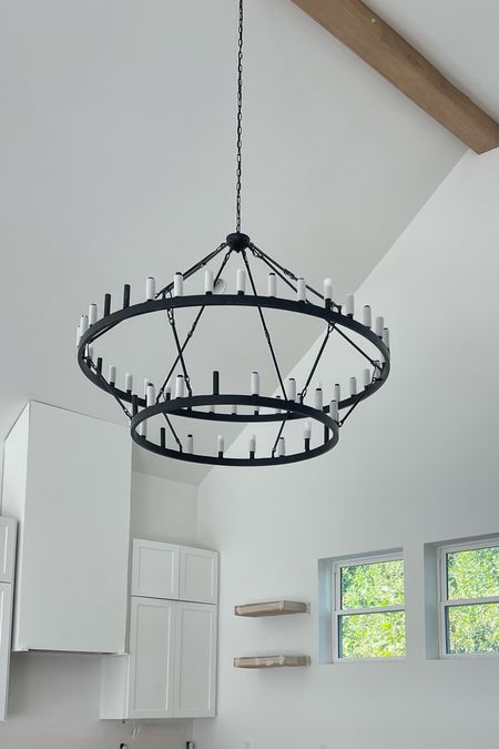 Linking my kitchen/living room chandelier that is absolutely INSANE HUGE BEAUTIFUL OBSESSED!!! The white foam things come off once we put bulbs in… this light is on sale too!! #wagonwheellight #homedecor #newhomebuild #customhome 

#LTKSeasonal #LTKstyletip #LTKhome