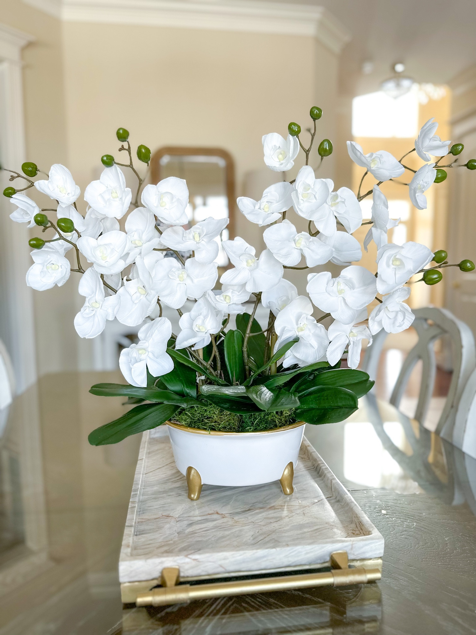 Here are all of the supplies you need to create an orchid planter! Faux orchids require no maintenance and stay beautiful forever! Head to IG @thespilledsugar for the full tutorial!

** I used 6 orchid stems, 6 leaves and 2 bamboo stakes for my arrangement **

DIY planter, planter ideas, floral arrangements, home decor, spring decorating, grand millennial style, traditional home decor 

#LTKhome #LTKSeasonal #LTKunder100