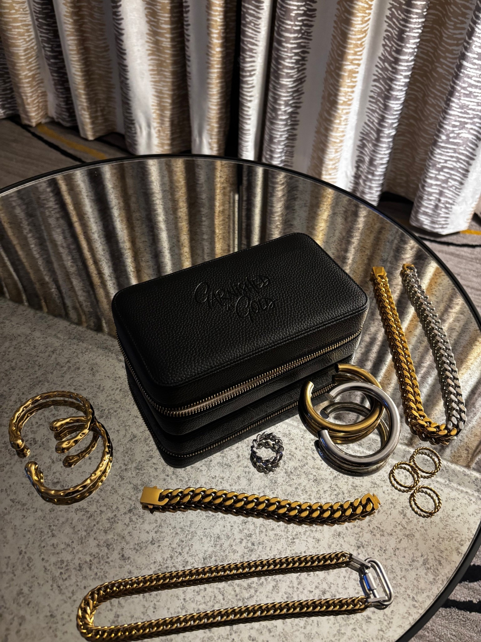 Garnished in Gold is one of my favorite places to build an everyday jewelry stack. Most of my pieces are under $100, a lot are under $50, and everything is tarnish-free, water-resistant, plus-size friendly, and perfect for everyday wear, work, date night, or travel.

What I’m wearing:
Gold cuffs, stackable rings, layered chains, and mixed metal jewelry. All from a Black woman-owned jewelry brand that prioritizes quality and affordability.
I also added the jewelry organizer I use to store and pack my pieces. It’s one of my most practical finds under $150—I’ve had mine for over a year and it keeps everything neat and protected. If you’re gifting jewelry or treating yourself, having a travel jewelry case really does make a difference and helps your pieces last longer.

Perfect for holiday gifts, stocking stuffers, or building your own signature jewelry stack.

I linked my full stack here—tarnish-free cuffs, waterproof rings, layered necklaces, mixed metals, and the organizer. These are the pieces I reach for every single day.

#LTKFindsUnder100 #LTKFindsUnder50 #LTKTravel