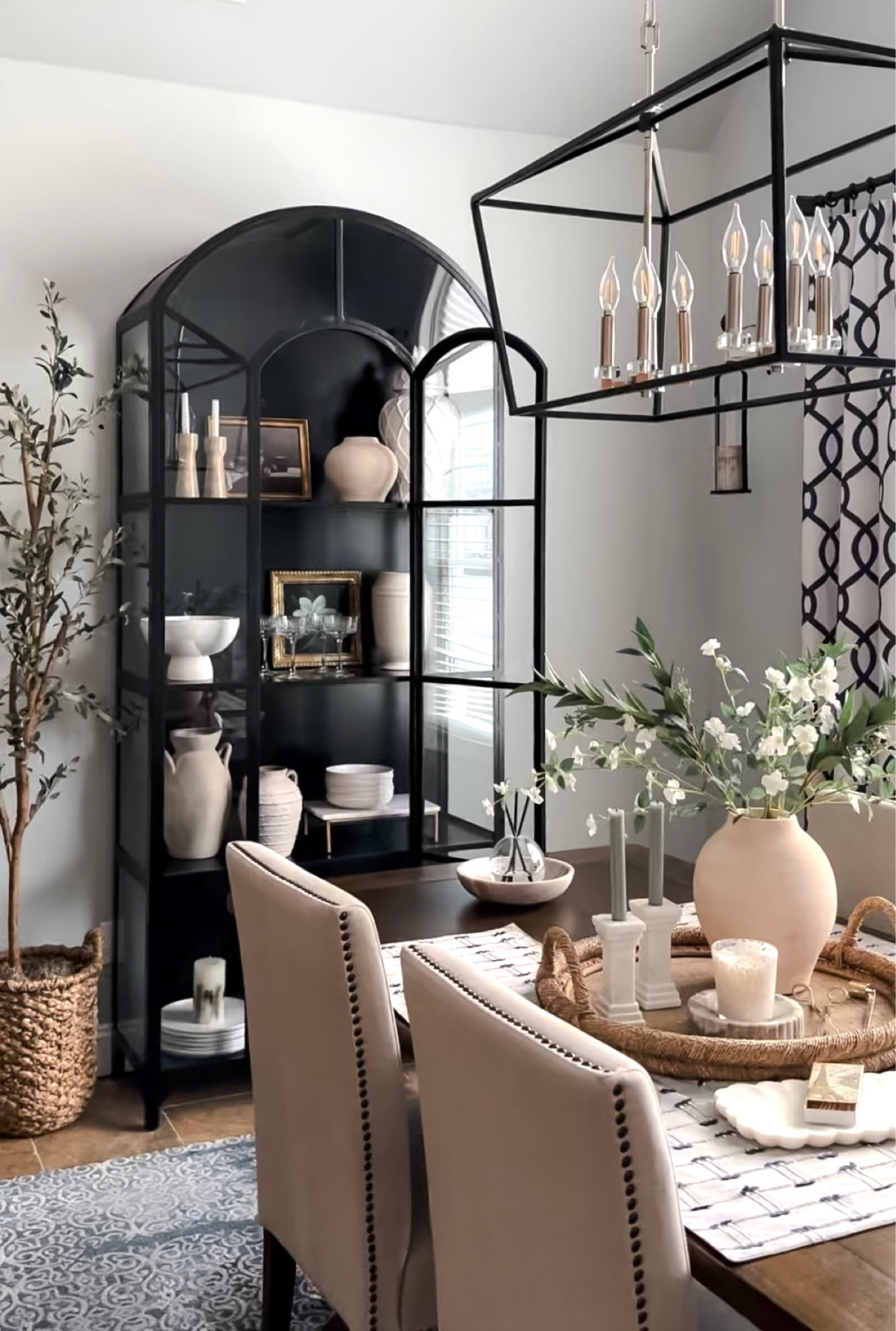 Dining room refresh. Black display cabinet, elegant chandelier, olive tree, new home decor accessories from Target, vase, marble candleholders, spring stems, tray, upholstered dining side chairs, wood table. Pottery Barn, Walmart, Arhaus, Wayfair. Free shipping. 

#LTKsalealert #LTKfindsunder50 #LTKhome