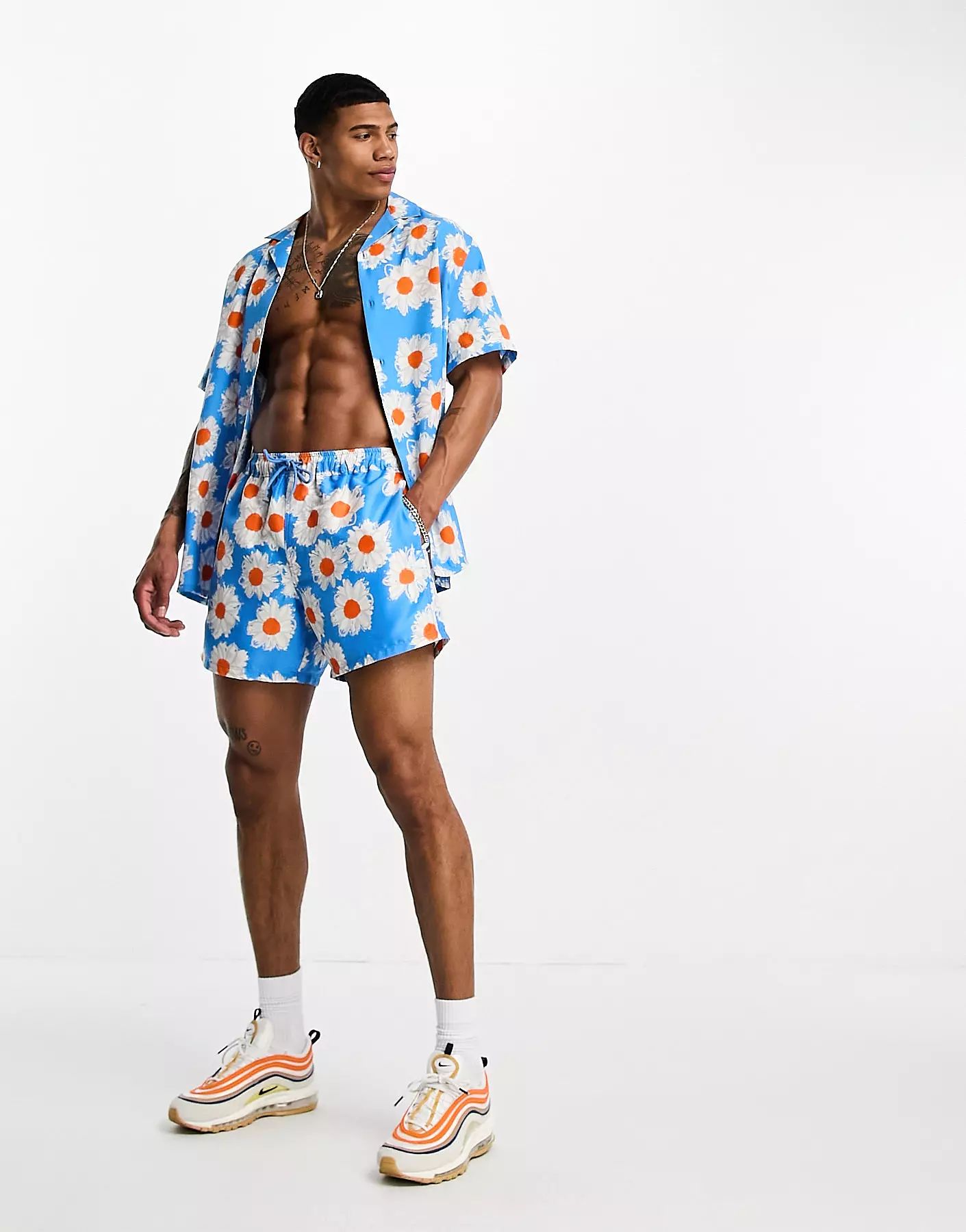 ASOS DESIGN swim shorts in short length in daisy print - part of a set | ASOS | ASOS (Global)