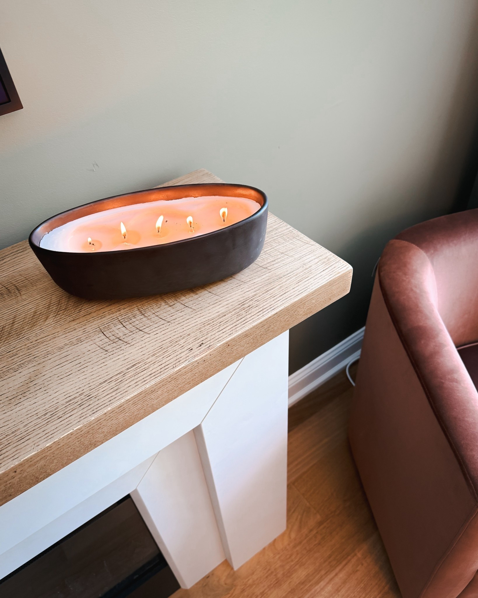 This large five-wick candle from Walmart adds a cozy ambiance and warm glow to the living room. The matte black ceramic container complements the oak mantel perfectly. It’s a budget-friendly way to bring texture and warmth to your fall home decor.

#LTKStyleTip #LTKHome #LTKOver40