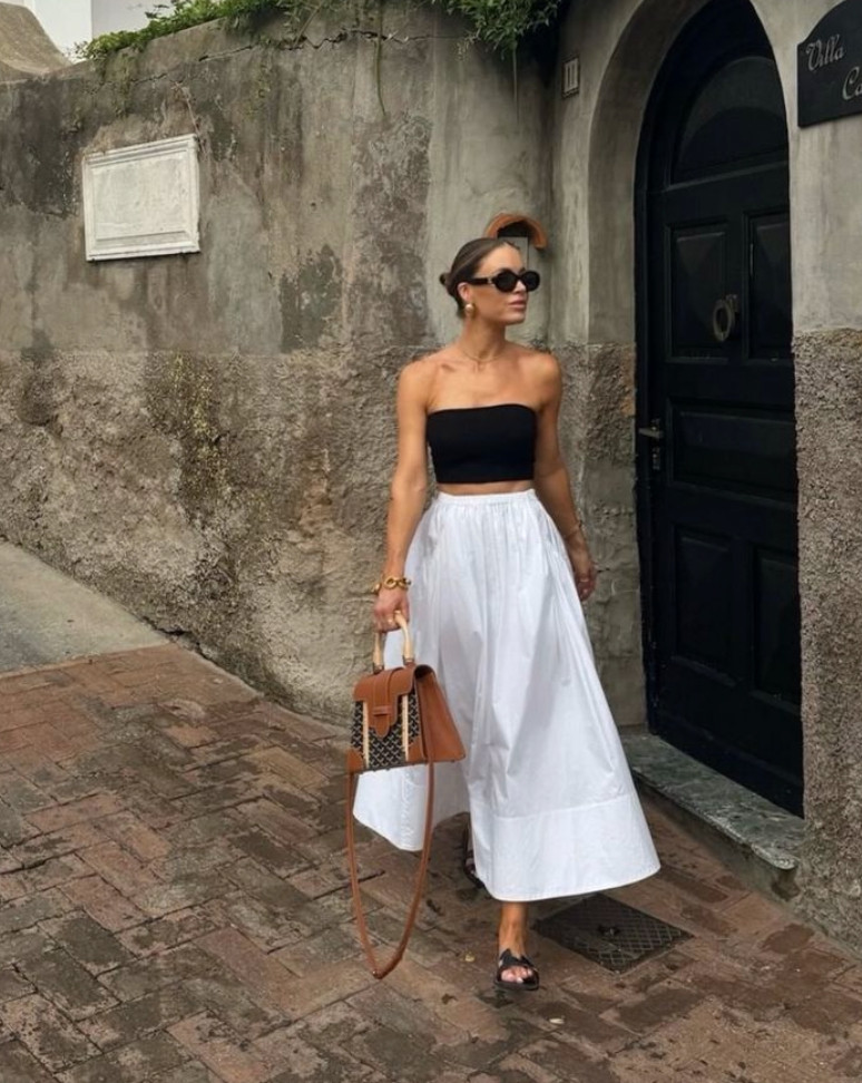 This classic summer outfit pairs a black strapless top with a flowing white maxi skirt for a timeless, effortlessly elegant look.
Neutral accessories, gold jewelry, and simple sandals create an easy warm-weather outfit that feels polished, feminine, and chic. 

 #LTKootd #LTKTravel