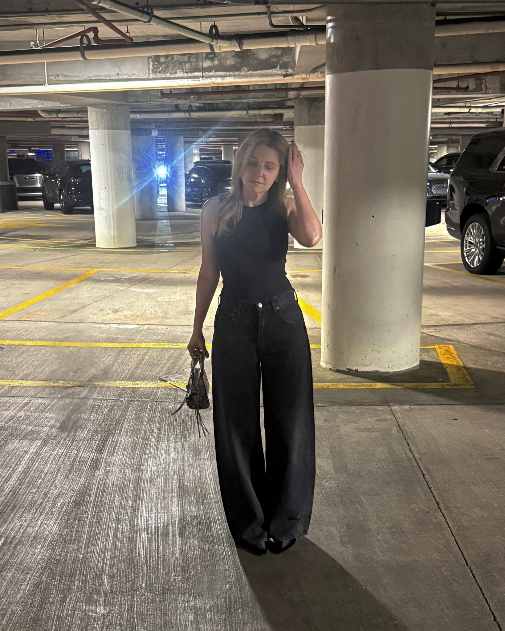 Outfit I wore to a Miami Heat game 🏀 These jeans I recently bought and am currently obsessed with (just bought another pair in blue) they’re from Agolde. I sized down and there’s still a baggy, barrel jean fit which I like. Top is a high neck sleeveless bodysuit from Aritzia. I’m wearing pointy black ankle boots and a snakeskin embossed leather top handle bag.

#LTKSaleAlert #LTKootd #LTKWorkwear