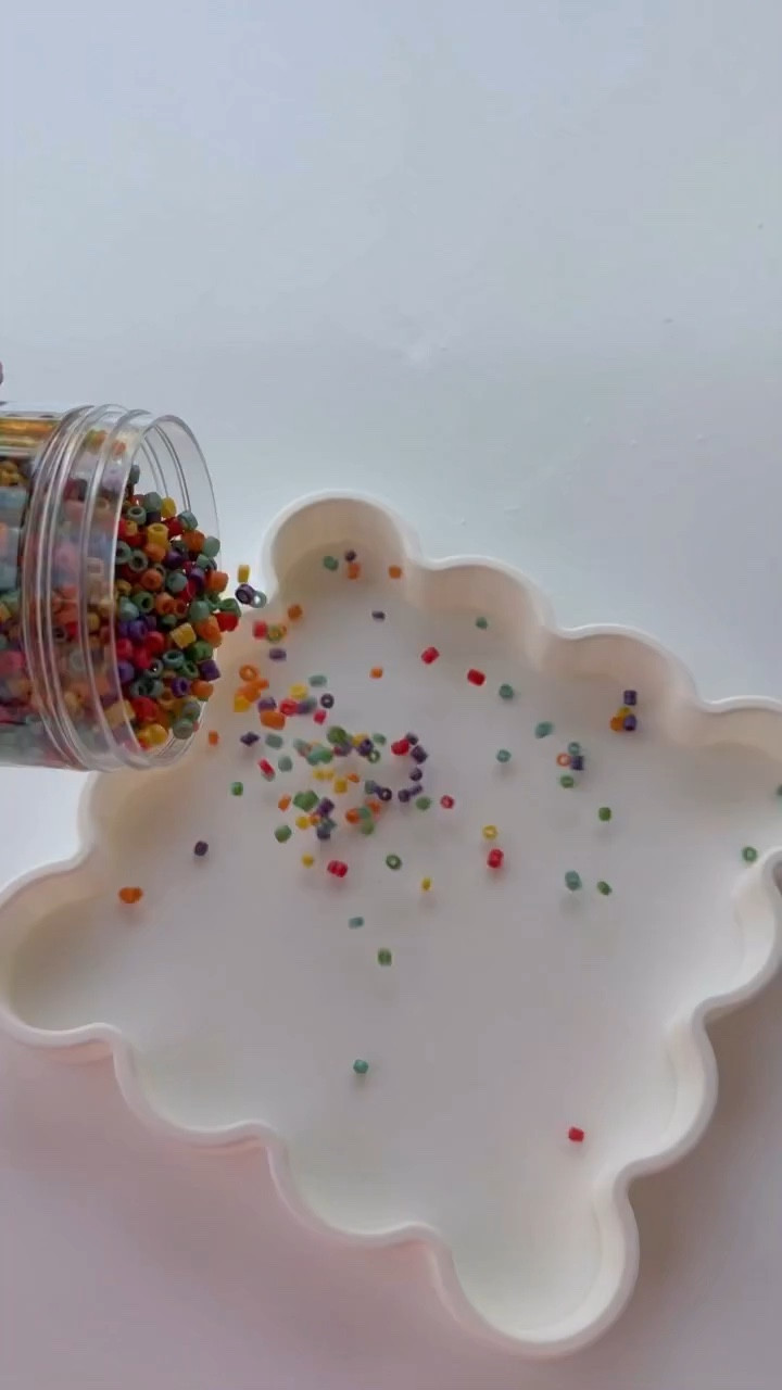 Pour, scoop, repeat ✨
This sensory filler is so satisfying to pour and run your fingers through 😍

This sprinkles of fun filler from @hippiehooray makes the easiest pour & play setup…perfect for color sorting, fine motor skills, and calm play time.

No complicated sensory bins, just dump it in a tray and let them explore 💛

✨ Follow @kenzs.kitchennn for real toddler life, simple activities, and hacks every mom needs.

#sensoryplay #toddleractivities #finemotorskills #easyplayideas #satisfying 

sensory filler, rainbow sensory play, pour and play activity, toddler sensory bin ideas, fine motor skills toddler, easy toddler activities at home, calming sensory play, independent play ideas, montessori inspired toddler play, colorful sensory tray

#LTKmomlife #LTKKids