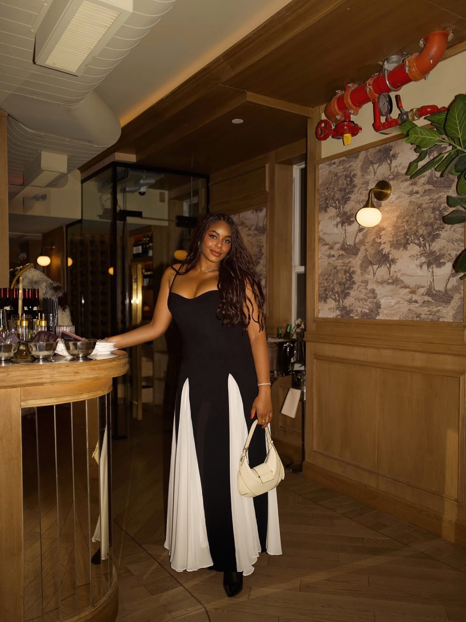 Out and about for a party with Jimmy choo! Wearing the cutest black maxi dress with contrast white pleats, Jimmy choo handbag, and Jimmy choo perfume of course! Love this striking, elegant dress that’s perfect for your next holiday party or winter wedding guest dress!

#LTKWedding #LTKdayinmylife #LTKHoliday