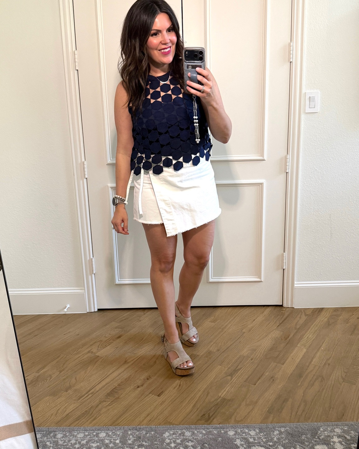 Amazon top that looks like designer! I got the deep blue which may be more of a winter navy, but I love it! Fits true to size. I got a dark blue gray or more of a Air Force blue camisole to wear under. Both tops are a medium. This is an old we the free skort and old platform sandals.