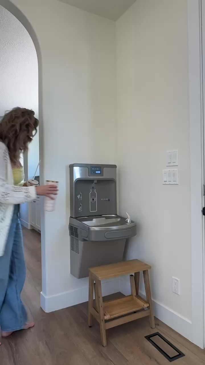 This is literally the best invention. This is probably the best Mom hack if you’re always feeling water bottles or finding cups all over the place this is one of those home details worth thinking about a bottle filling station and drinking fountain gives you a dedicated spot to refill throughout the day. Planning a mudroom or home renovation? Save this idea. #ltkhome #ltkmomlife