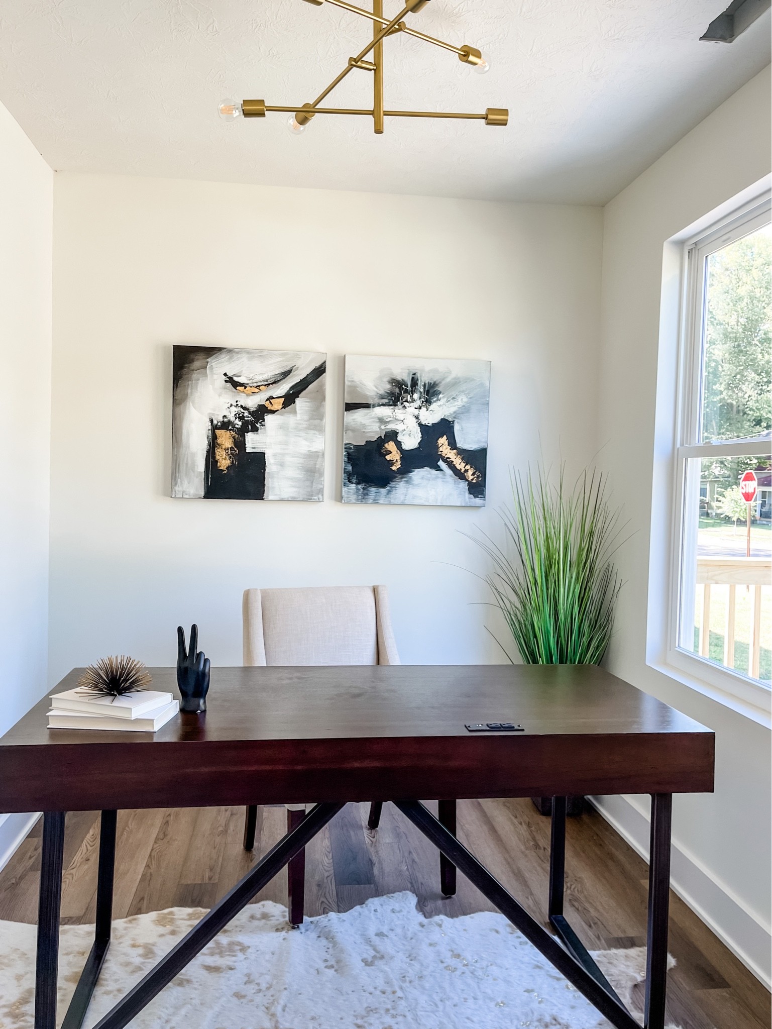 A fun home office! We incorporated golds, blacks & wood tones. 

#LTKhome #LTKstyletip