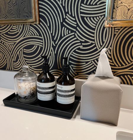 Guest bath home decor with small details! Love keeping things nice and organized with a tray to hold my Aesop soap & lotion duo. Also use glass cloche to go over candles or other items! Linking my wallpaper, tissue box cover and more! 

#LTKhome #LTKstyletip