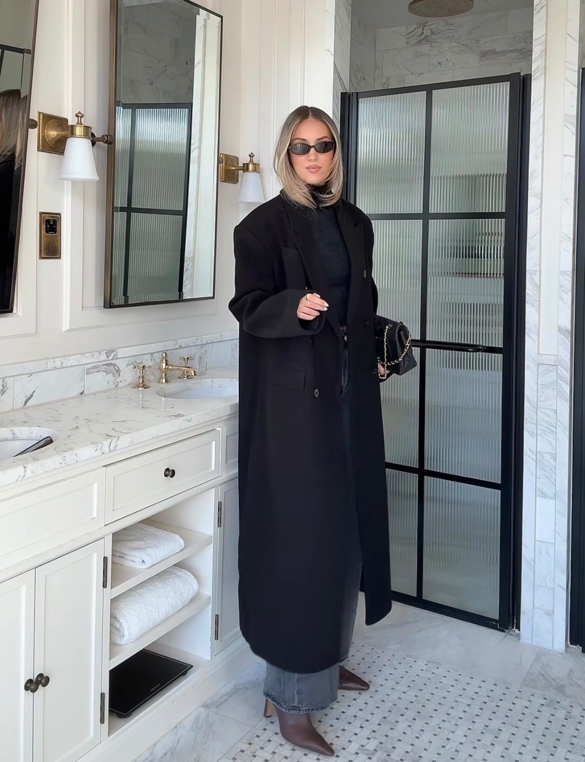 Black coat 

Black sweater 

Dark brown boots

Gray jeans 

#LTKootd #LTKHoliday #LTKSeasonal