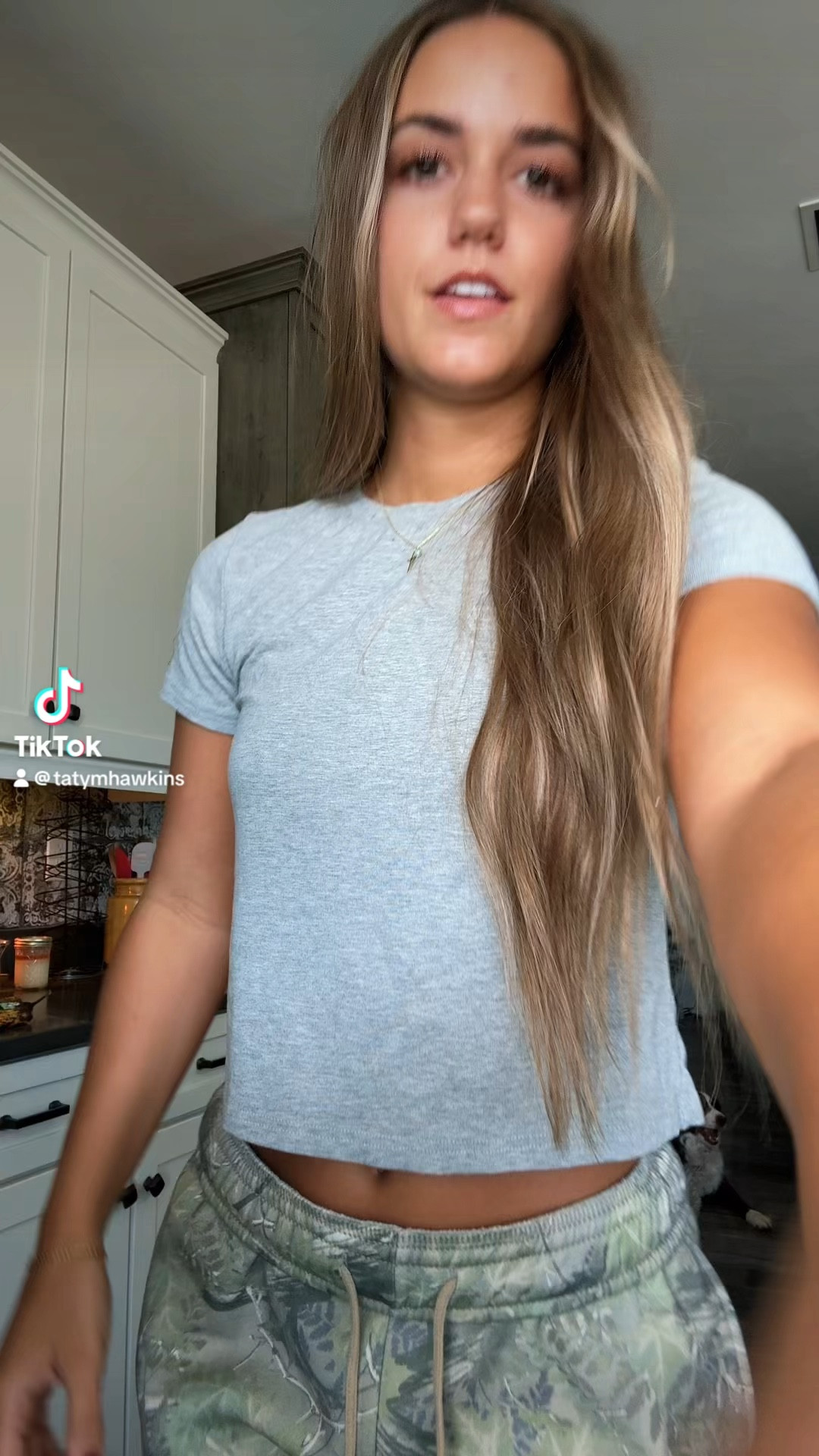 Camo sweats and grey shirt
Wearing small