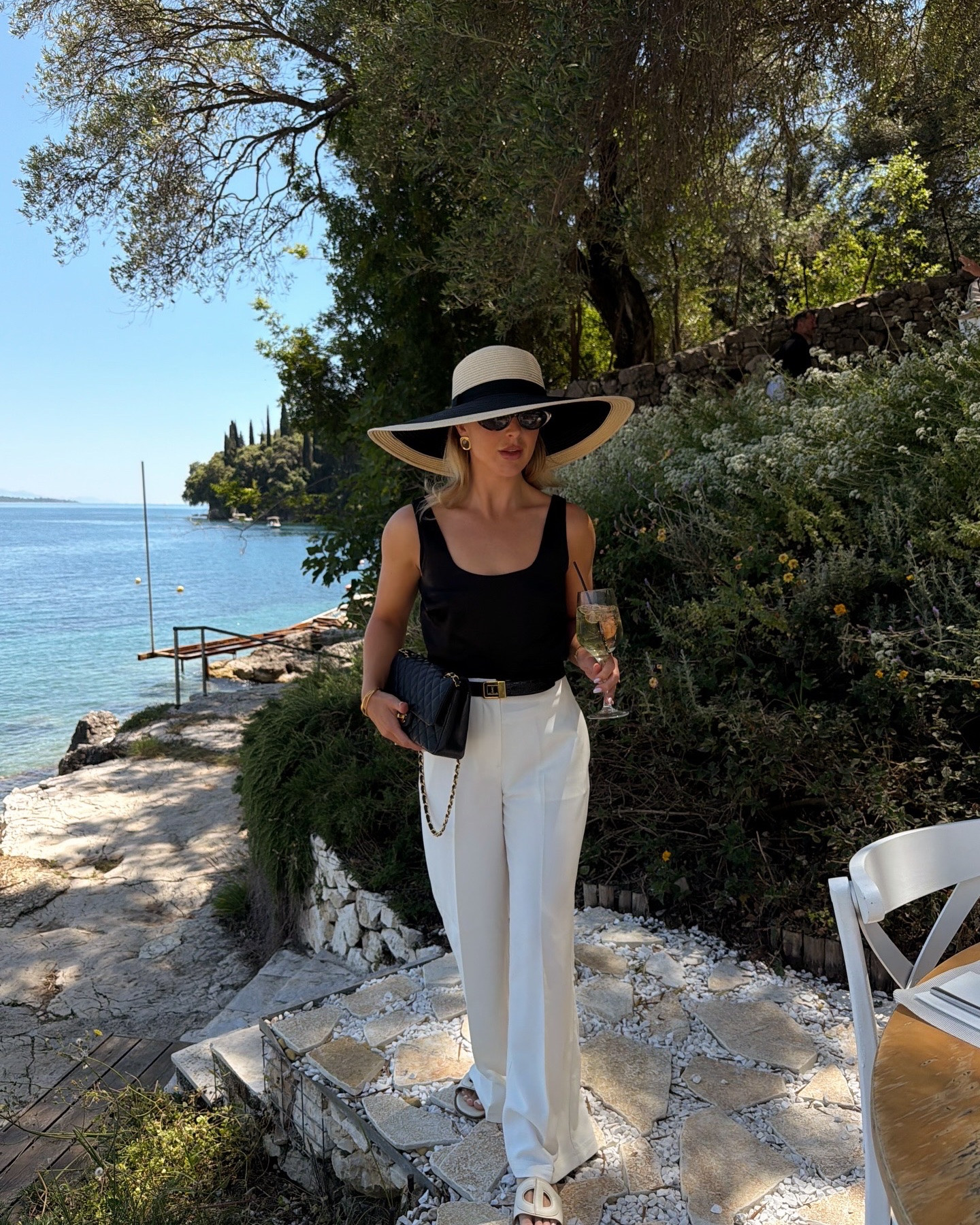A chic black and white outfit styled with accessories

#LTKsummer