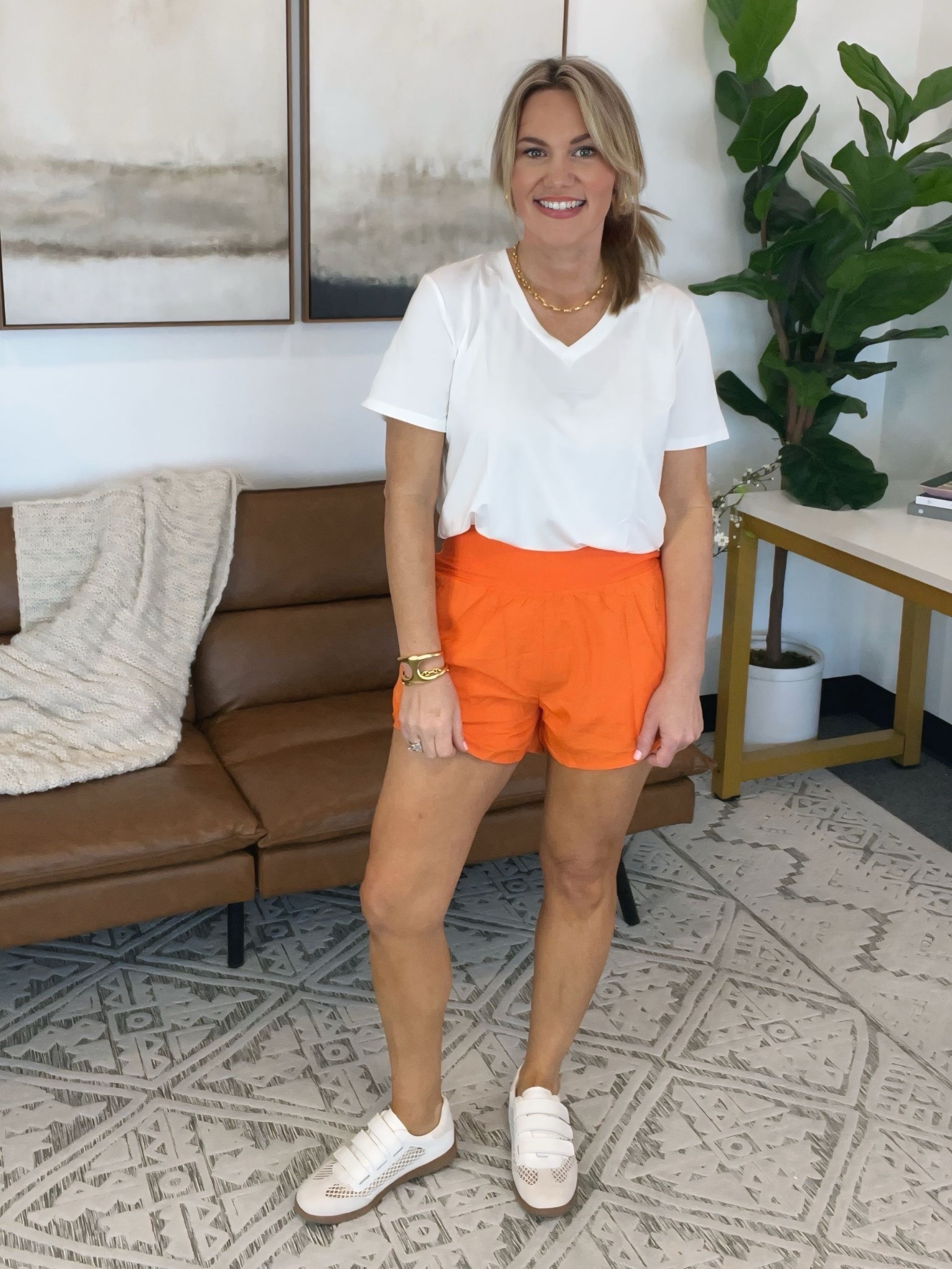 Clean summer color with an elevated everyday feel. This white V neck paired with a bold orange short creates a polished off duty look that still feels intentional. Finished with a comfortable neutral sneaker that works for errands, travel days, or casual meetings.

Medium top, medium shorts, size 7.5 shoes

AudrieDollins, amazon fashion, pinspark, orange shorts outfit, white v neck outfit, casual chic outfit, everyday elevated style, summer outfit idea, neutral sneakers, project cloud shoes, comfortable fashion, effortless style

#LTKmomlife #LTKfitnessgoals #LTKActive