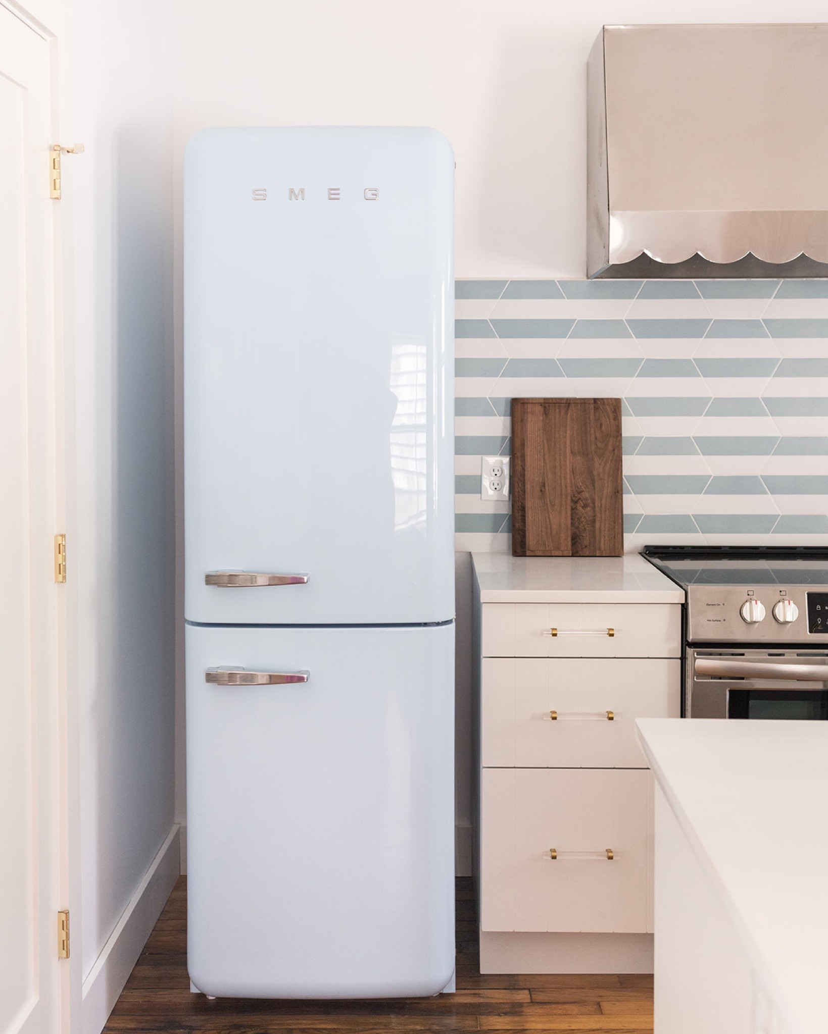 this corner of the kitchen at the #mixedusemini features a few of our favorite details, including the world's cutest fridge and an adorable scalloped range hood that was actually a vintage find! #dwelloctoberstay #dwelloctober

#LTKFindsUnder50 #LTKFindsUnder100 #LTKHome