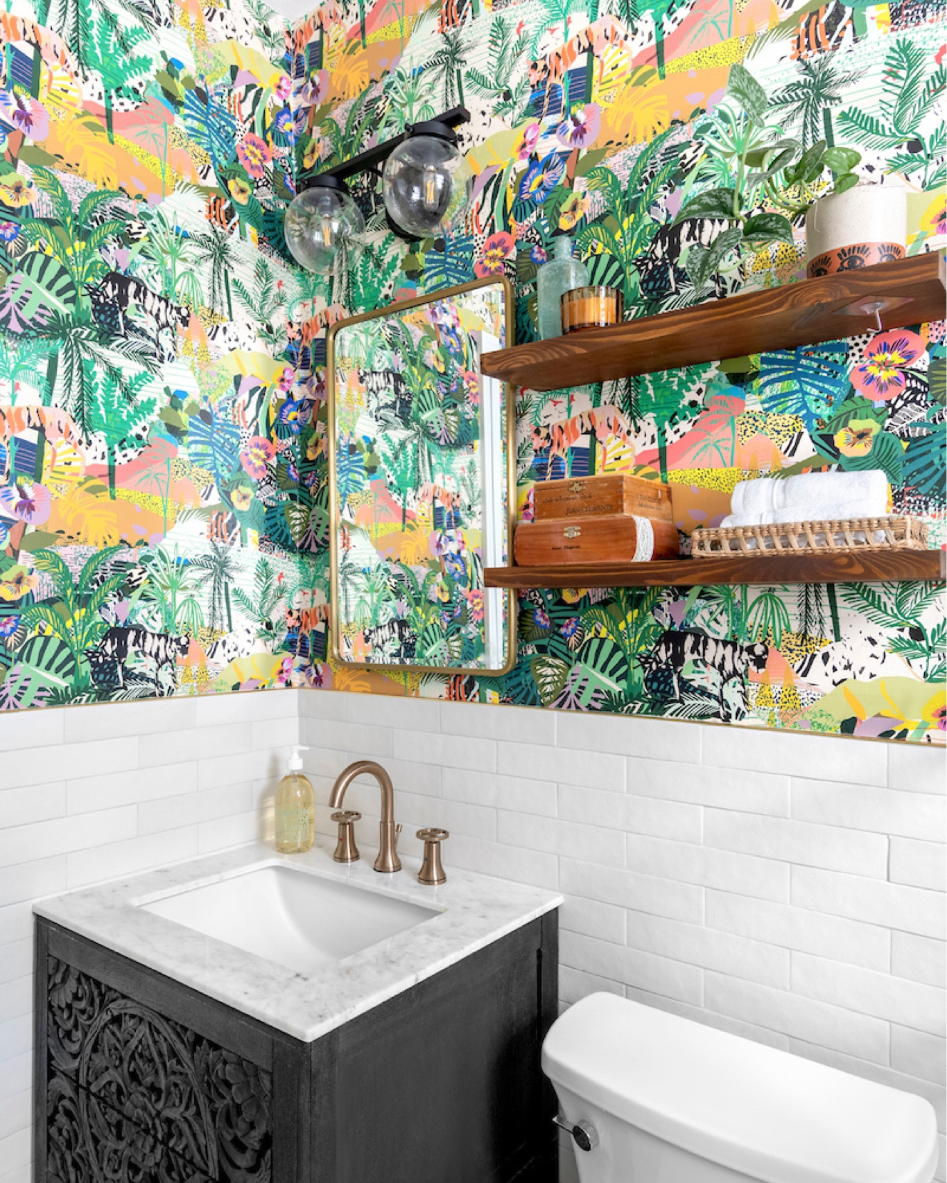 Bold Bathrooms. Yes please! Check out this funky, eclectic jungle styled bathroom we recently remodeled in Miami, FL. #boldbathrooms #junglethemed #bathroomwallpaper #boldwallpaper #junglewallpaper #smallbathroom 

#LTKhome