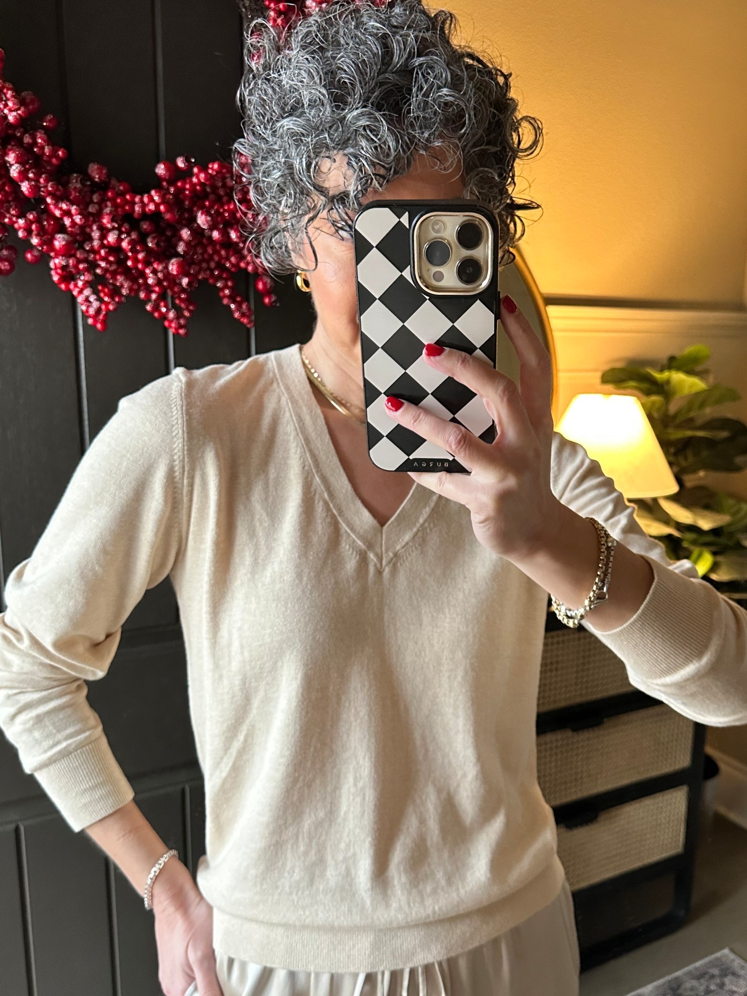 Quince cotton/cashmere v-neck. Back in stock in the color I’m wearing “Heather Oatmeal”. Wearing a medium. This is a great sweater option if you live in a warm climate but still want a light layer 