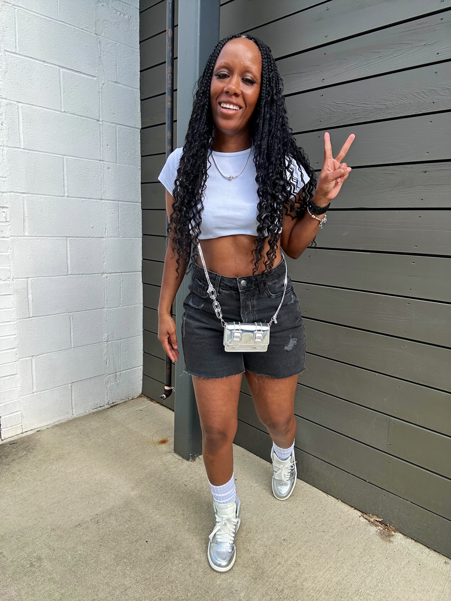 How to style Jordan 1 Chrome summer outfit idea. I’m wearing a basic white crop top with black washed high rise cutoff shorts. I styled this outfit with a silver mini crossbody bag.

#LTKFestival #LTKstyletip #LTKfindsunder50