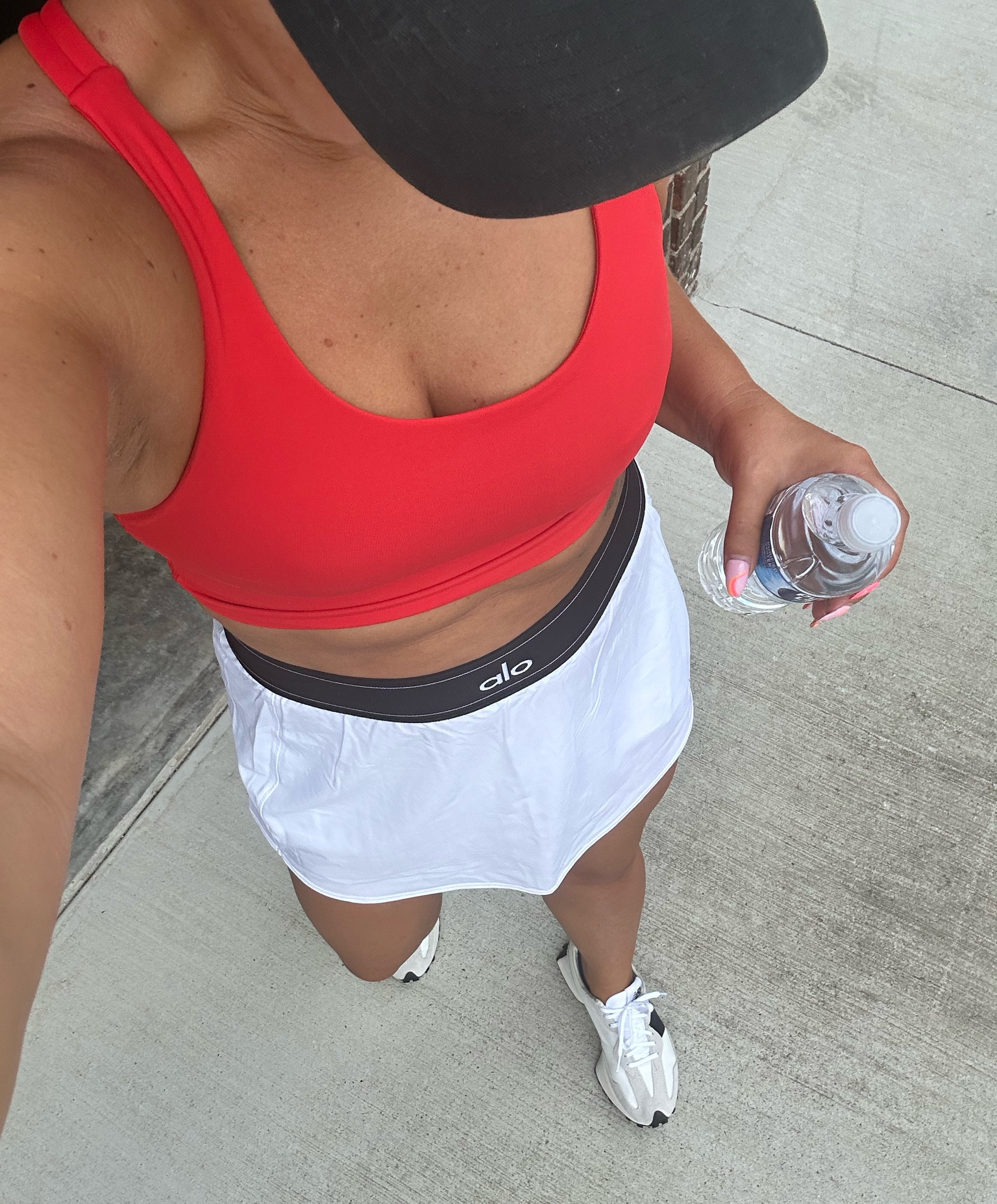 OOTD! This long line sports bra is one of my new favorites and I love the vibrant red color! I wish this tennis skort came in multiple colors because it’s so comfortable and super cute! I’m in a size 6 in the bra and size medium in the skort! These new balance sneakers are on trend right now are super comfortable and run true to size! #newbalance327 #lululemon #alo 

#LTKshoecrush #LTKFind #LTKstyletip