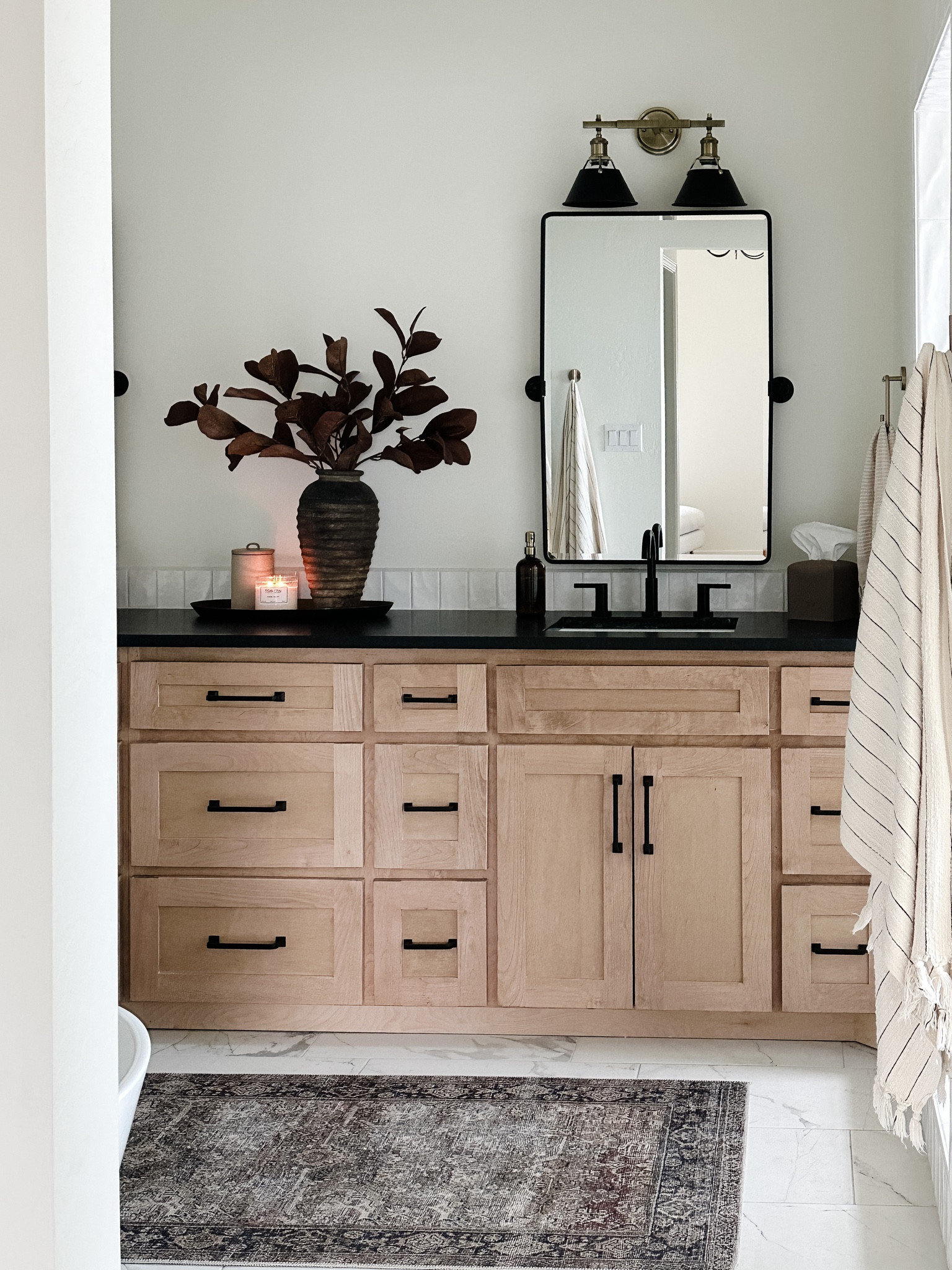 Master Bathroom Styling!

wood vanity, brass and black light fixture, widespread faucet, fall stems, brass tray, stoneware canister, iron cabinet hardware, tilt mirror, Loloi Layla charcoal rug, transitional style, home decor 

#LTKhome