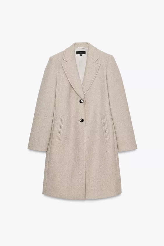 Coat with lapel collar and long sleeves with shoulder pads. Double-welt front pockets. Hem with b... | Zara US
