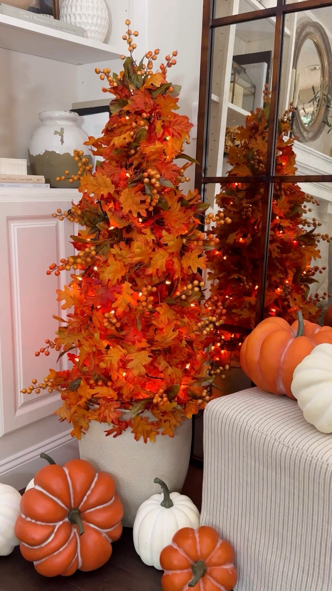 DIY Tomato Cage Fall Topiary Tree 🍂 instantly transforms your space with autumn vibes effortlessly and affordably! 

Elevate your seasonal decor with this chic DIY hack, turning a garden center tomato cage into a high-end designer-style fall topiary. Add a touch of elegance while saving money and bringing pretty fall flair to your home this season! I absolutely love how this tree instantly adds a touch cozy fall ambience to my home. 

Are you ready for Fall? 

Create a DIY Tomato Cage Fall Topiary Tree 🍂: Add your own flair and enjoy!! 

Materials: Tomato cage, planter, leaf garland, string lights, berry accents. Suggested for indoor use or covered porch. 

Instructions: 
1. Secure tomato cage onto planter or tuck inside a planter or urn. Use a zip tie or rubber band to fasten the top ends together.
2. Wrap and tie cage with leaf garland until completely covered. I used 5- 6ft garlands. I wanted full coverage and a lush layered look. 
3. Add string lights for a warm glow.
4. Tuck in berry accents for texture.
5. Enjoy your cozy fall decor! 🍁


#LTKSeasonal #LTKHome #LTKStyleTip