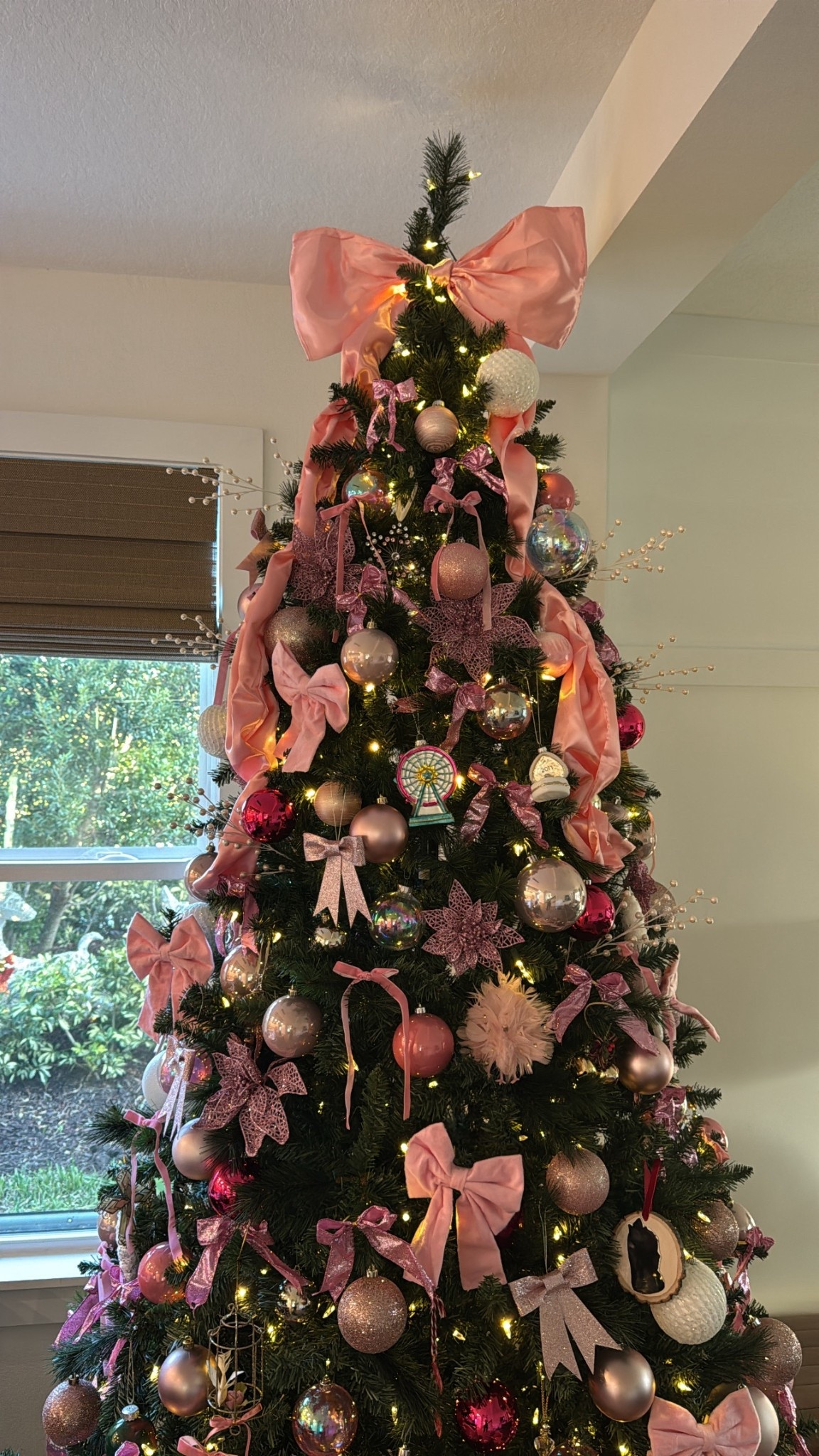 Bow Christmas tree decorations using this $20 topper from Amazon 

#LTKSeasonal #LTKHome #LTKHoliday