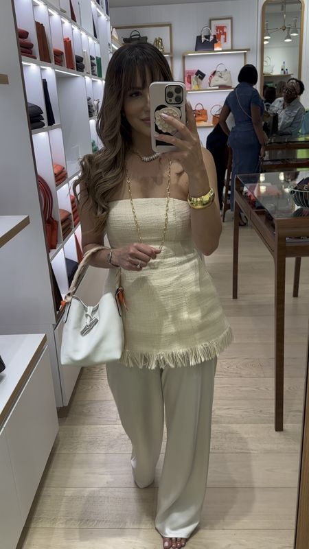 OOTN for an evening with longchamp. Loving this crisp white bucket bag for summer! It comes with a crossbody strap making it a great everyday bag. Wearing size 4 top. (Runs slightly small.)

#LTKStyleTip #LTKItBag