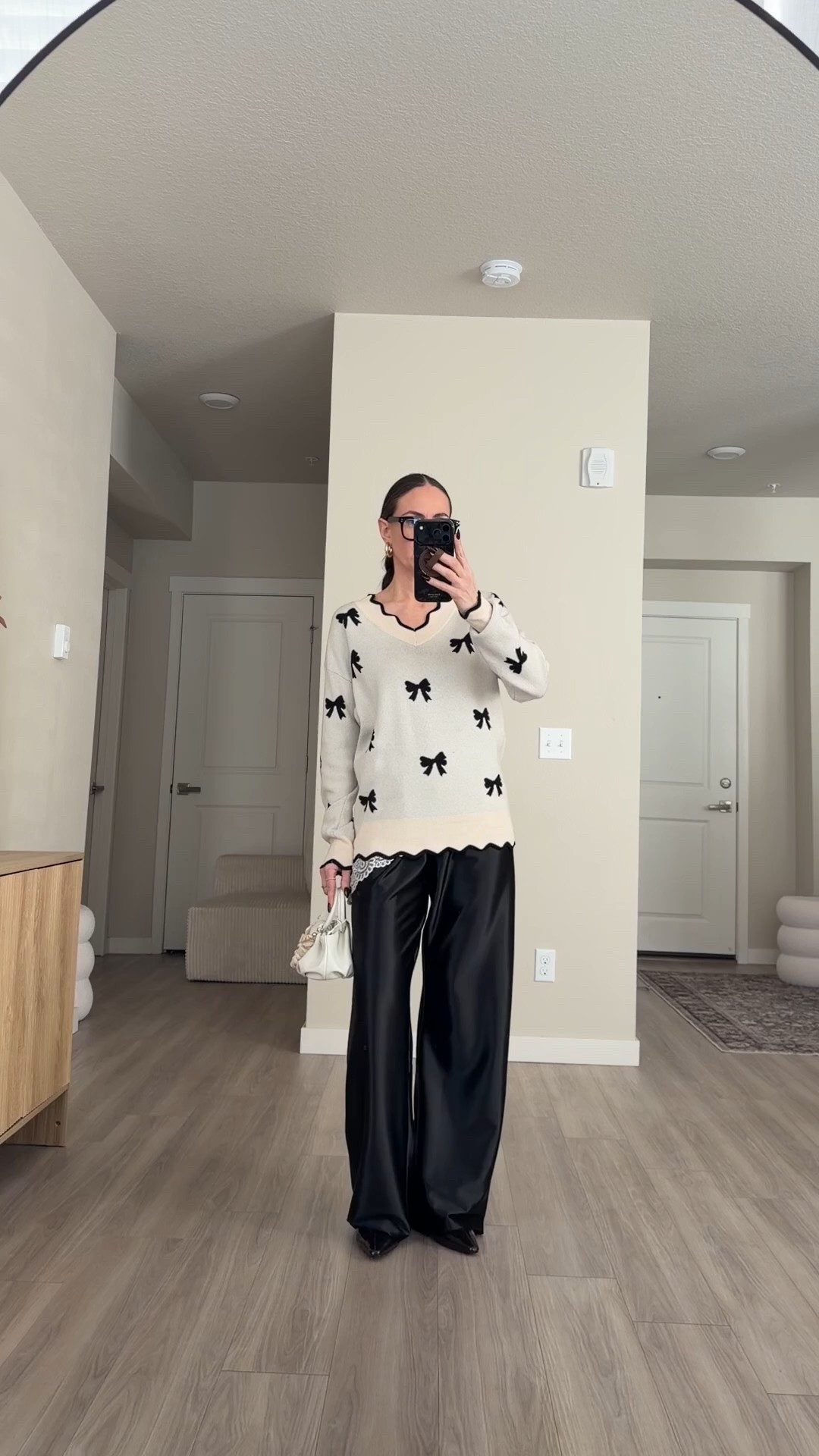 satin pants wearing size small. m 5'7 so the length just hits fine for me.  
not wearing a lace top but a lace scarf around my hip.  will link a lace top anyway.  

valentine's day bow sweaters.  black and white valentine's day sweaters #satinpants #bowseaters #valentinesdaysweaters #coolgirlfashion 
