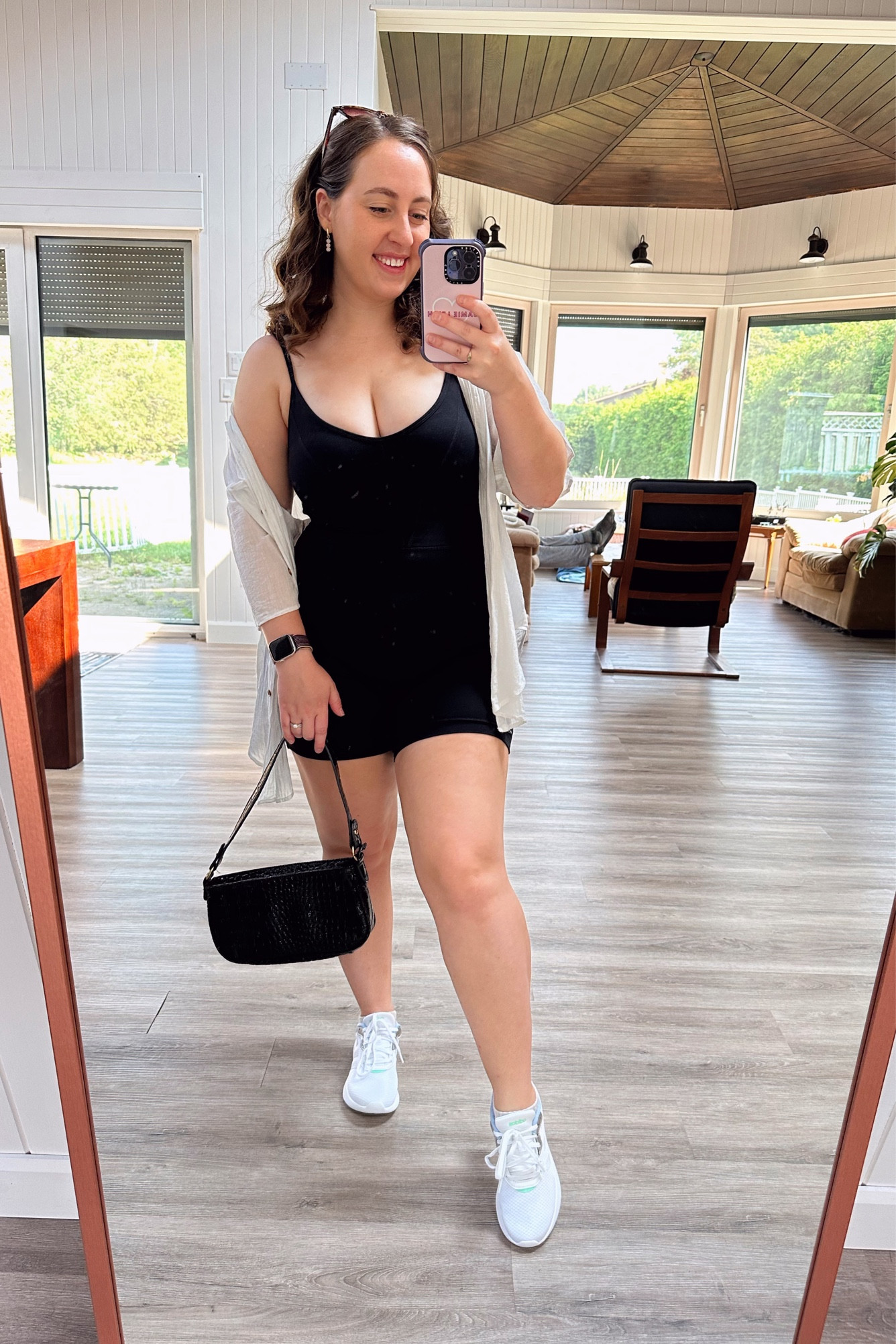 One of my favourite ways to elevate a comfortable romper - throw on an oversized linen or gauze shirt! This full white and black look is comfy enough to wear all day long as a travel outfit, for running errands, going to a coffee shop, or walking your dog while still looking effortlessly cool! You could swap out the handbag with a crossbody or belt bag for a more casual look, or dress this up with more jewelry and oversized black sunnies. The possibilities are endless, and you will be so comfortable all day long! 

#LTKtravel #LTKSeasonal #LTKstyletip