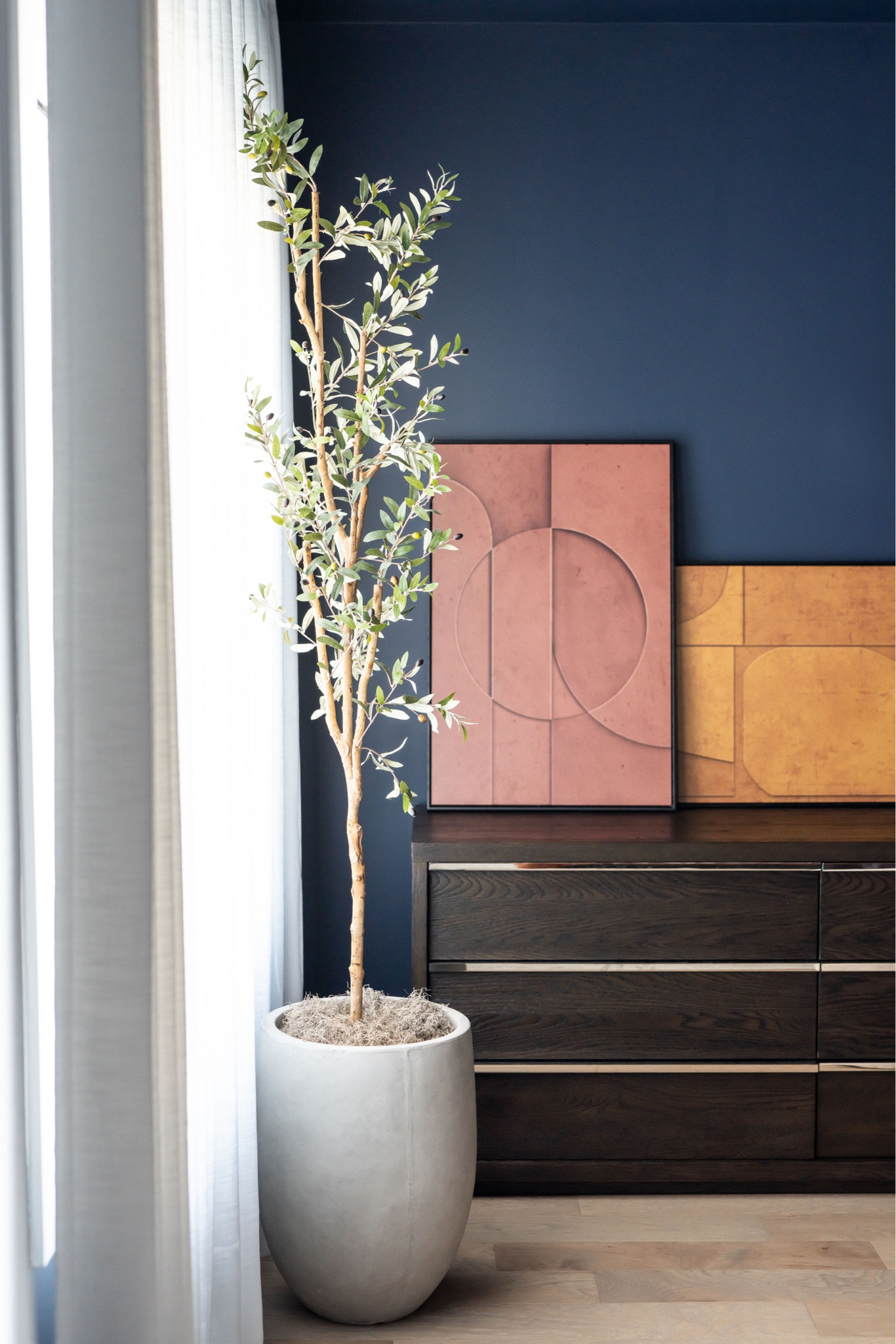 Olive tree in bedroom with colorful art 

#LTKHome