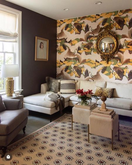My media room/living room design with dark brown paint, velvet cube ottoman, cream sectional, crane wallpaper, gray roll arm chair, vintage gold mirror

#LTKhome #LTKFind #LTKstyletip