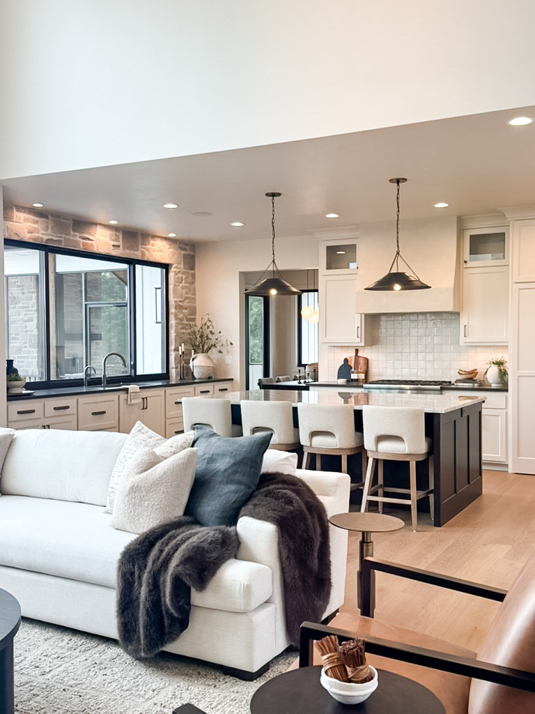 This modern kitchen creates a warm space that's both functional and visually striking. 

#homedecor #homeremodel #showcasehome #kitchen #livingroom  

 #LTKHome
