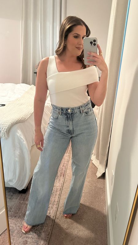 Summer night out outfit 
White top for summer 
One shoulder top 
Revolve Sale
Wide leg jeans 
Clear heels 
Night out outfit 
Summer night outfit 
Nude heels 
Gold jewelry 
Uncommon James 
Le Labo
Spring outfit 
Summer fashion
Spring fashion
White top and jeans 

#LTKunder50 #LTKstyletip #LTKunder100