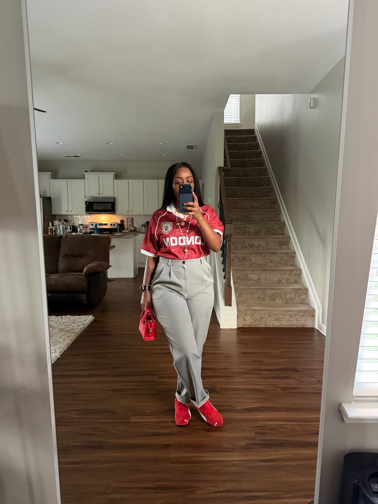 Styling a soccer jersey shirt with pleated trouser pants

#LTKootd #LTKOver40 #LTKPetite