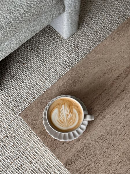 Porcelain mug and saucer. Jute cotton mix rug. Wood coffee table. Accent chair off white boucle textured 

#LTKfindsunder50 #LTKhome #LTKsalealert
