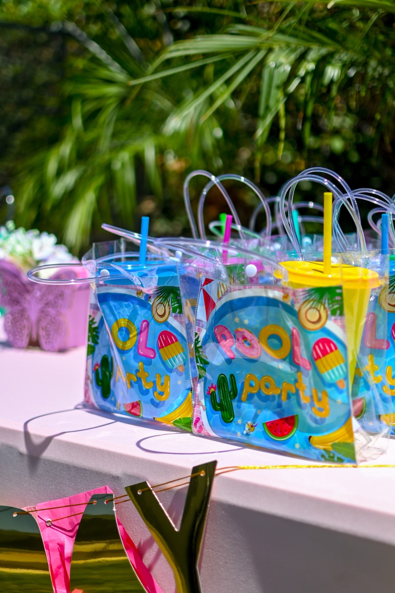 Gift bag for pool party including favor items that are useful and colorful. 

#LTKSwim #LTKKids #LTKSeasonal