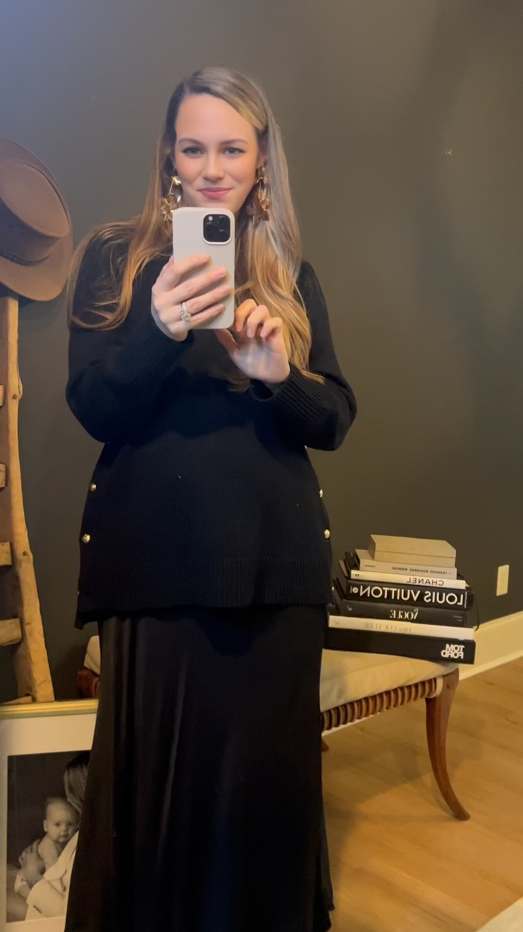 Loose layering love. 

Long black silk maxi skirt paired with an oversized black sweater and some fun gold accessories + statement earrings. Great option for workwear and maternity! 