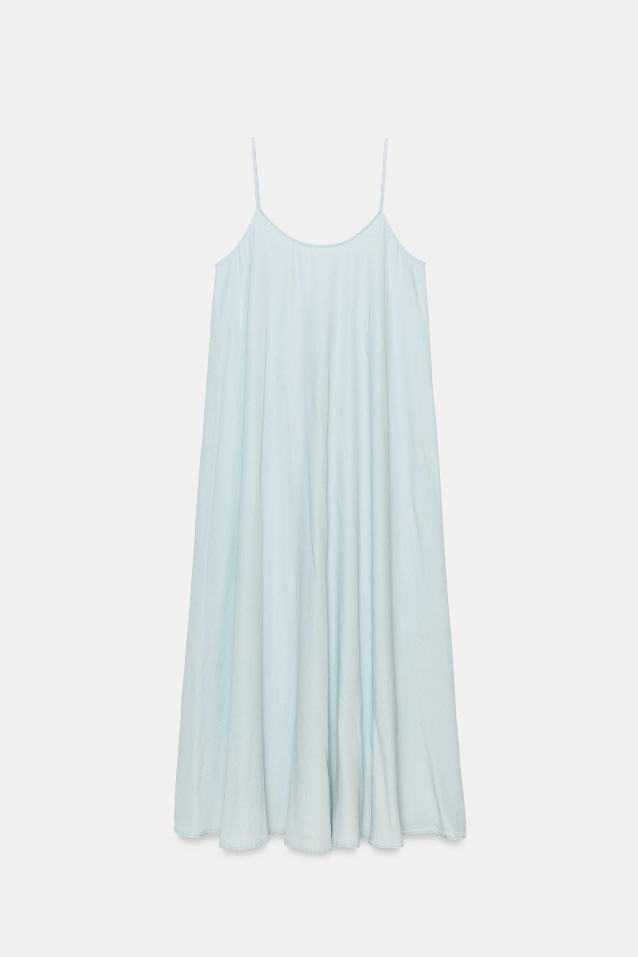 Long dress with main fabric made of 100% lyocell yarn. Round neck and spaghetti straps. Back tie ... | Zara US