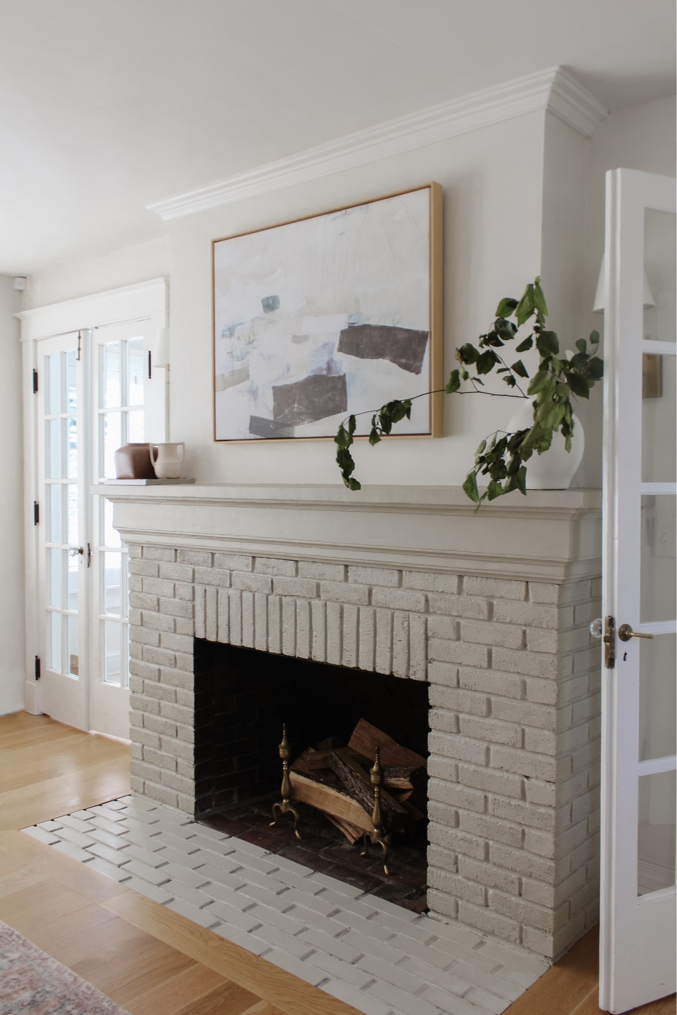 Large canvas art and fireplace decor 

#LTKfindsunder50 #LTKstyletip #LTKsalealert