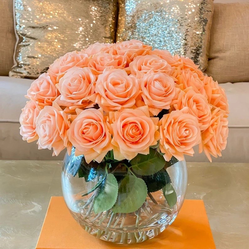 Add timeless elegance to your space with this stunning real-touch rose centerpiece by flovery. Handcrafted in the USA, this modern arrangement features lifelike roses artfully arranged in faux water for a natural, sophisticated look. Perfect for dining tables, entryways, or special occasions, it brings a fresh, contemporary touch that lasts year-round. 🌹✨ #flovery #RoseCenterpiece #EtsyFinds #ModernDecor #HomeStyling #FloralDesign #LTKHome #LTKDecor

#LTKSeasonal #LTKHome #LTKWedding