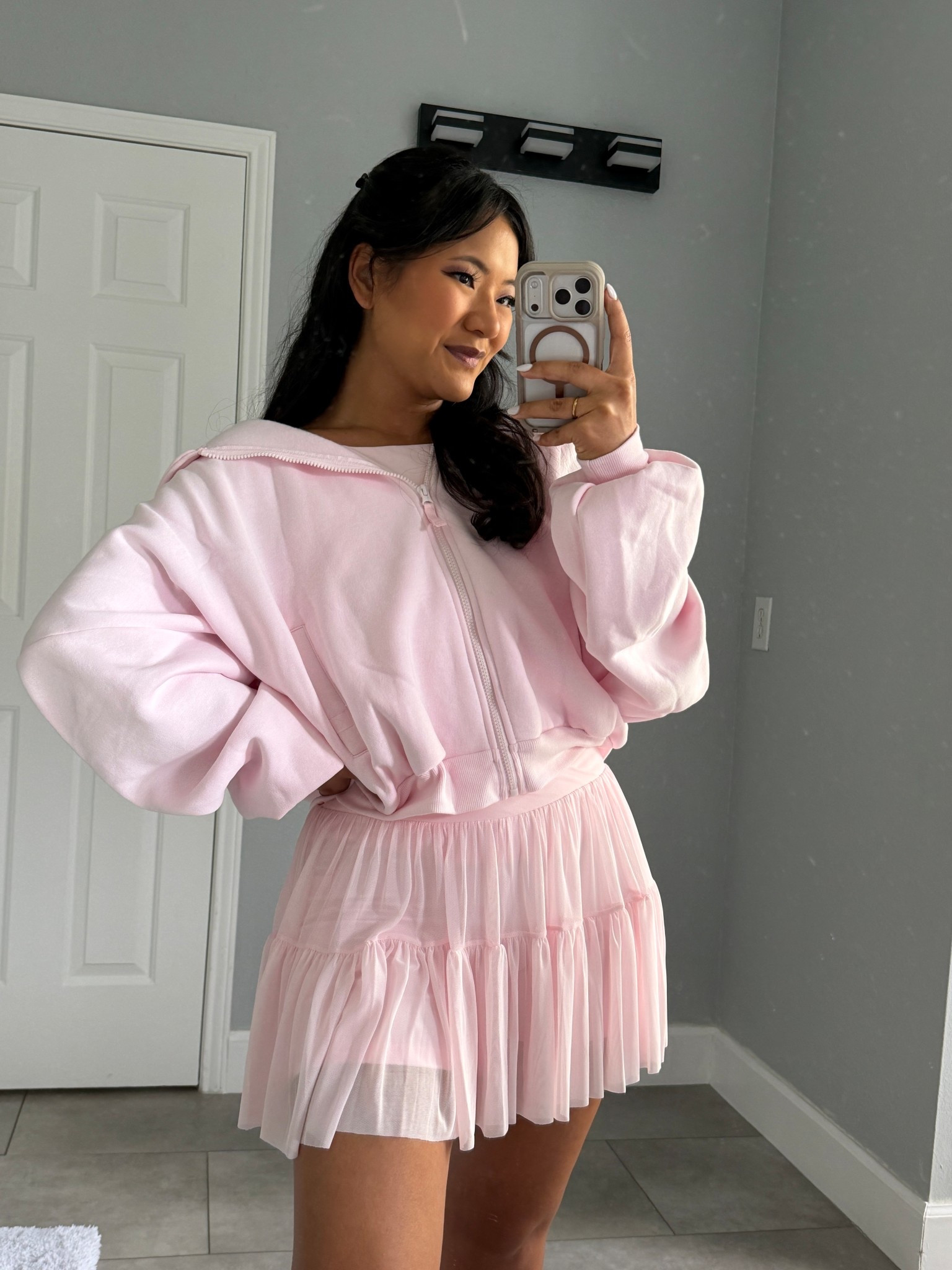 Blogilates Women's Ballerina Skort wearing size medium. Blogilates Women's Boatneck Crisscross Tank Top wearing size large. Blogilates Women's Marshmallow Full Zip Hooded Sweatshirt wearing size medium. 